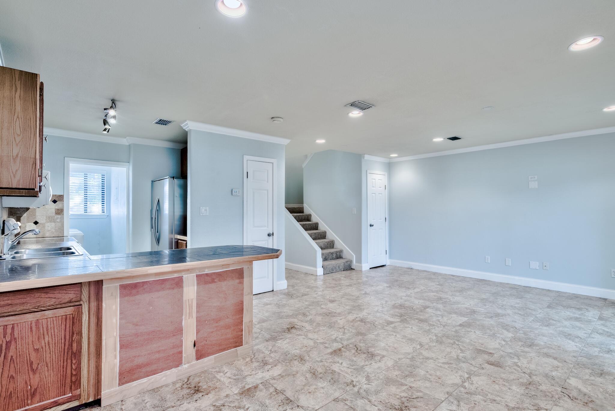 Featuring a fenced-in back yard, tile flooring downstairs, open concept main level, back porch, and located just a short walk away to the Destin Main St. Park which offers a bayou front pier and dock for fishing. Pine Ridge Trace is perfectly located just East of Main St., and is a short ride away to the beach, harbor, and all of the restaurants and shopping that Destin is known for.