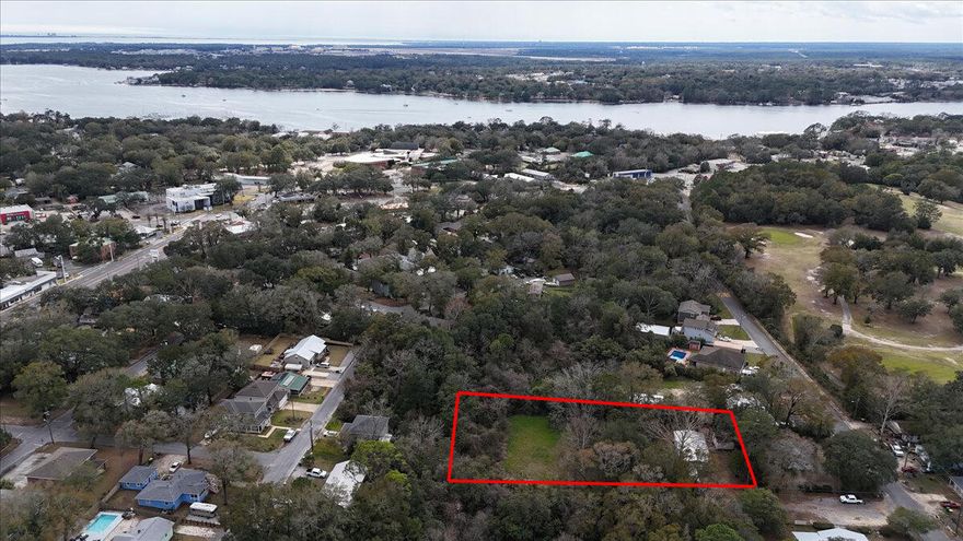 This oversized .88-acre property is a rare find in a quiet Niceville neighborhood. It includes two parcels and a livable 1997 double-wide (3 beds, 2 baths, 2 sitting rooms), with utilities and septic already in place. Looking to build? With City approval, this could be split into multiple buildable lots. Plus, no flood zone, no HOA, and no restrictions--just land, opportunity, and options! Located minutes from Eglin AFB, Hurlburt Field, and Duke Field, and just 15 minutes from the world-famous white sand beaches of the Emerald Coast!