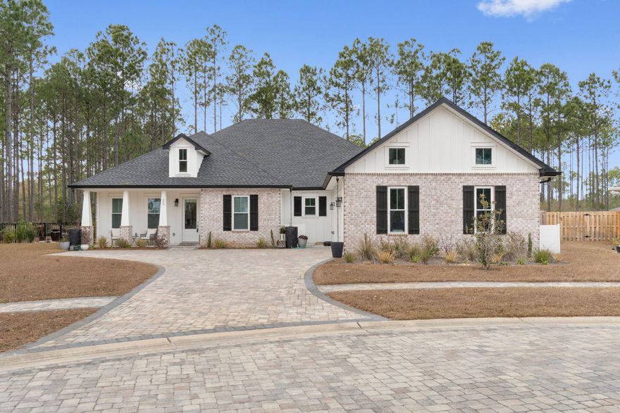 Embark on a Journey of Elegance at 23 Vintage Cv, Hammock Bay As you approach the tranquil streets of Hammock Bay, a sense of serenity and exclusivity envelops you. Nestled here is 23 Vintage Cv, a craftsman-style jewel. This is not just a home; it's the embodiment of a dream lifestyle, where every detail is a testament to luxury and comfort. Imagine driving up to this picturesque property, where the facade exudes a timeless charm. As the front door opens, you're greeted by the warm embrace of luxury vinyl plank flooring. With over $110,000 of Upgrades that include Pool, Fence, Generator, Attic Lift, Landscaping, Patio, Flooring, Quarts and Storge Building... leading you into a world where every space tells a story of elegance and warmth. The heart of this home is undoubtedly the gourmet kitchen, a masterpiece of design and functionality. Here, the Statuary Classique quartz countertops glisten under the soft lighting, while the latest black stainless steel appliances stand ready to assist in crafting your culinary creations. It's a space where family recipes come to life and friends gather around, sharing stories and laughter.

Flowing seamlessly from the kitchen is the living area, a testament to sophisticated comfort. The exposed brick arch and the gentle flicker of the gas fireplace create an ambiance of refined relaxation. Picture yourself here, unwinding after a day's work or hosting an intimate gathering, the fire casting a warm glow on the faces of your loved ones.

As the day draws to a close, retreat to the tranquility of the bedrooms. The primary suite, a sanctuary of peace, features trey ceilings, adding an air of grandeur. The en-suite bath, with its elegant Cotton White quartz, is your private spa, a place to rejuvenate and dream.

Step outside to the backyard, where the heated inground pool awaits. Surrounded by a screened lanai and a backdrop of mature pine trees, it's an idyllic setting for sunny afternoons and starlit evenings. The fenced yard, backing onto a wooded preserve, ensures privacy and a connection with nature.

This home is more than a residence; it's a haven for those who seek a life of beauty and ease. At 23 Vintage Cv, every day is a celebration of the finer things in life, a continuous journey of discovery and pleasure.

Welcome to your new home, where luxury is not just a feature, but a way of life.