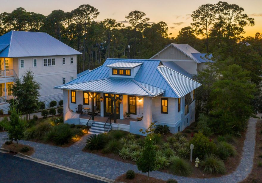Within the gates of Lakeside at Blue Mountain Beach lies this incredible residence built as a personal home by the builder himself. Custom touches greet you throughout the home including cut pine paneling and pecky cypress accents. Three ensuite bedrooms and a loft frame an open concept kitchen and living area.  The two car and golf cart garages are designed below street level to maintain curb appeal. Beach access with parking, restroom and shower facilities is located less than half a mile south from the entrance to this neighborhood. The community of Lakeside at Blue Mountain offers a neighborhood pool and is conveniently located just north of Scenic Highway 30A in Blue Mountain Beach bordering Redfish Village, which provides shopping & restaurants just a short walk away.