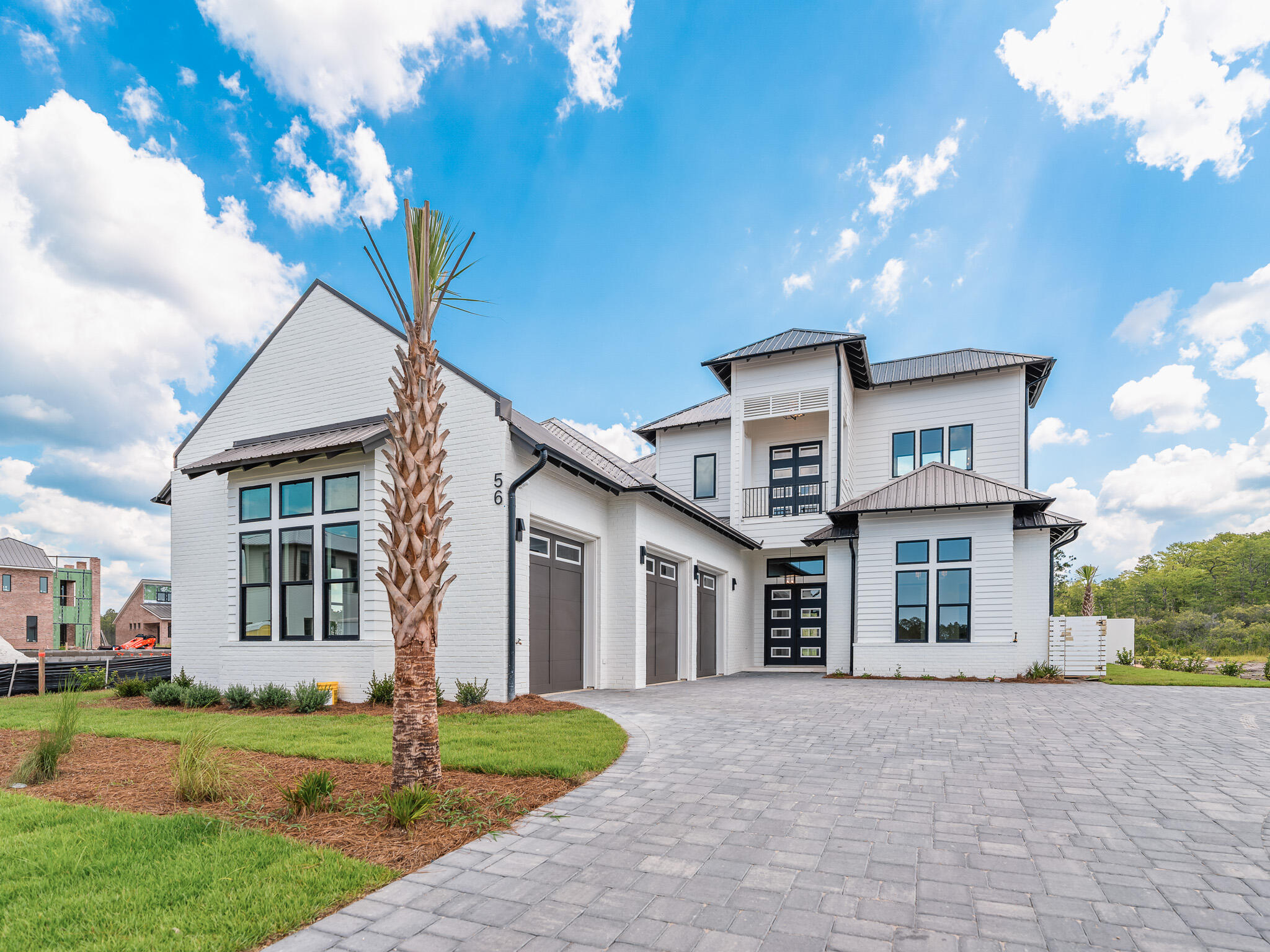 Designed by renowned architect John Williams, this elegant new construction--nestled behind the private gates of Camp Creek--showcases impeccable craftsmanship paired with refined coastal charm throughout. The kitchen is a chef's dream, featuring custom-milled cabinetry, an expansive island, quartz countertops, and a luxury appliance package complete with a gas range. Flowing seamlessly from the kitchen, the spacious living and dining areas provide direct access to a covered porch with an outdoor kitchen, blurring the lines between indoors and out to create a continuous space for both relaxation and entertaining.