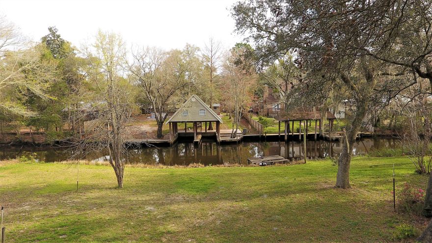 Lot sit on 250ft of a navigable canal that leads to Mallet bayou and the Choctawhatchee Bay. Lot features beautiful Florida Live Oak trees. The property has an older home in need of attention with detached garage, summer kitchen, and an out building.