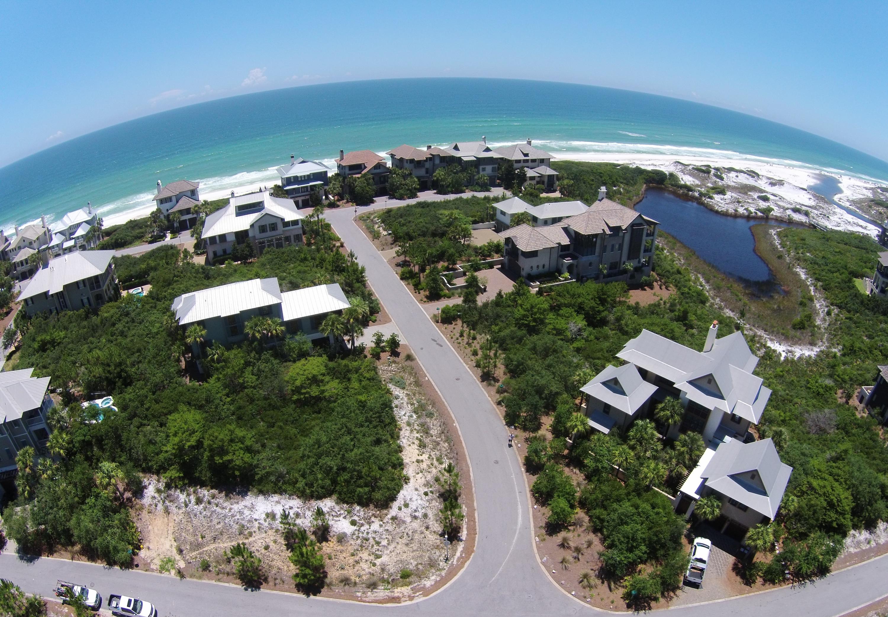 Private beach enclave with pristine surroundings makes this beautiful corner lot special. High elevation, four lots from the Gulf and one lot off Draper Lake and the nature preserve allow for possible gulf, lake and preserve views. The Retreat is located along 30-A in Blue Mt. Beach nestled between Draper Lake, and the Gulf of Mexico. The Retreat attributes; 90 lots on 90 acres, 3,000 feet of beach frontage, a gulf front beach club with an infinity edge pool and owner storage locker, coastal dune lake pavilion and canoe launch on Draper Lake, gated security entrance, night lights in trees at gate entrance and streetlights, meandering road set back from 30-A, no build out time requirement, restricted from short term rentals and stunning architecture throughout the neighborhood.