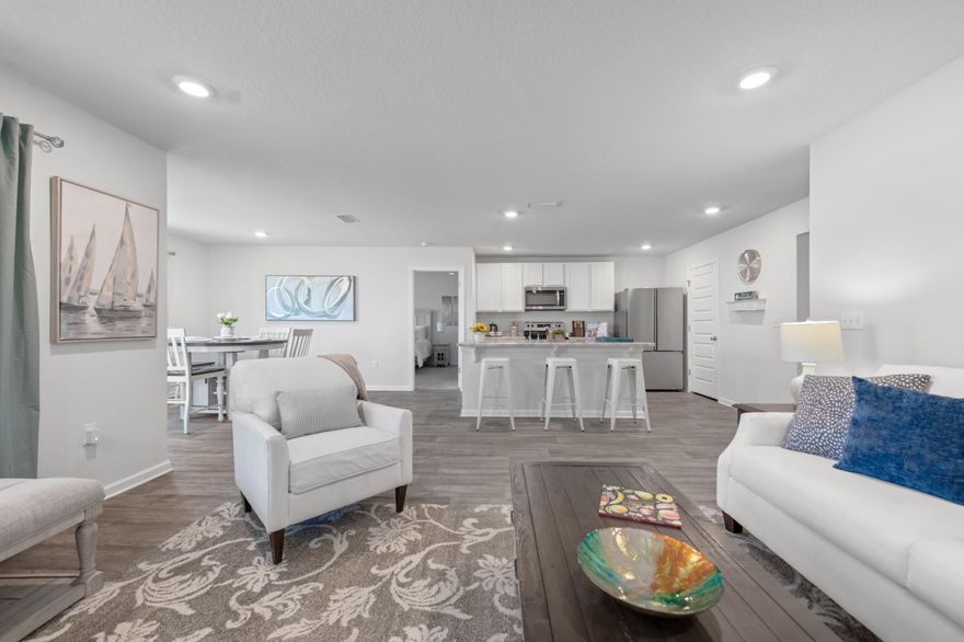 Welcome to 193 This Way in Freeport, FL. As you step inside, you'll be greeted by luxury vinyl plank flooring throughout the home. The bedrooms are carpeted with a split floorplan that offers privacy and convenience for all.The heart of the home is the kitchen with a spacious island, stainless steel appliances, and a breakfast bar that provides ample space for meal preparation and entertaining.