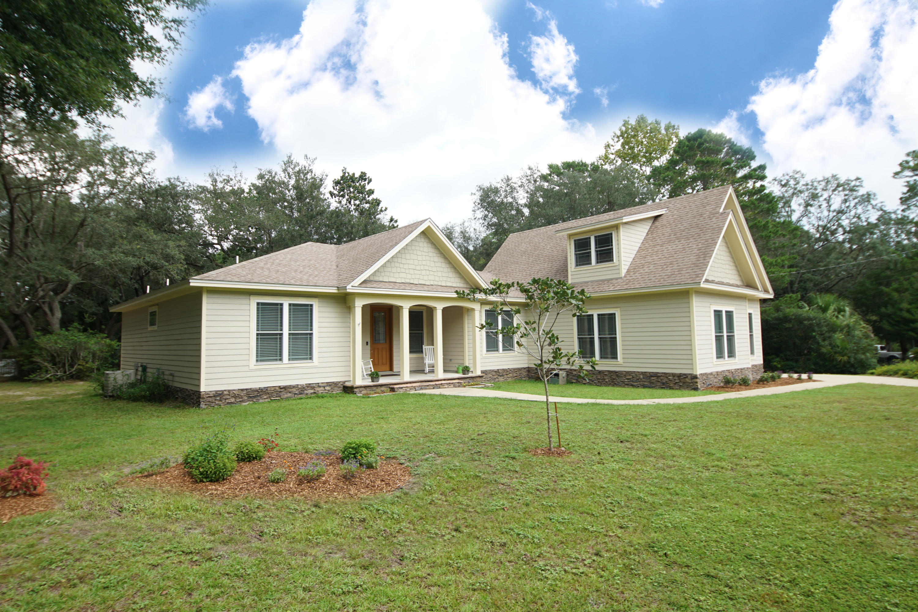 REDUCED PRICE!This beautiful newer home has a modern farmhouse vibe. Many custom additions and a well thought out floor plan. Located in the sought after established neighborhood of Valparaiso Shores. Owners purchased empty lot and built this home in 2016. There is 2366 total square feet with 3 bedrooms and 3 full baths plus a large upper level bonus room (475 sq ft). There are granite counter tops throughout with Shaker style cabinets. The kitchen has stainless steel appliances, a counter breakfast bar with decorative stone on the seating side. Double French doors in the family room open to a large covered porch, including a natural gas grill. Both front and rear porch have bead board ceilings. The master bedroom is over sized with a large walk-in closet. Very serene on a 1/2 acre lot.