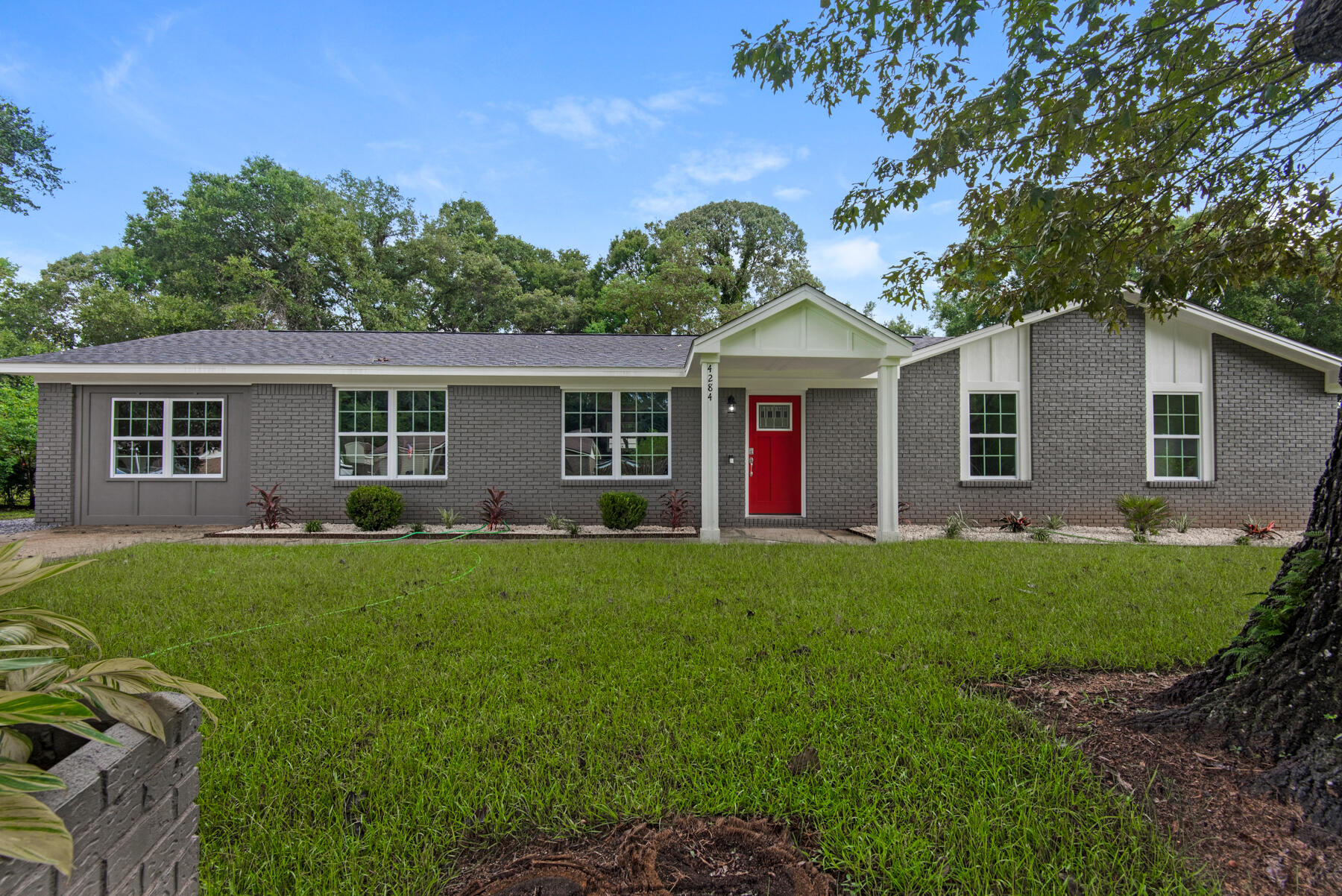 Seller is offering a $4,000 credit towards buyer's closing costs or buy-down! This 4 bedroom home is centrally located and FULLY renovated. Inside you have NEW kitchen cabinets, quartz countertops, appliances, paint, tile in the showers, new vanities, fixtures, hardware, all flooring, hot water heater (2022) and smart home features already installed. Outside you have a new roof (2021), new double pane windows, all new soffits, trim, and paint. The backyard is large, level, fully fenced and complemented by a concrete patio and brick fireplace ready to entertain or cook your homemade pizzas. This is one that you don't want to miss. Contact Evan for your showing today