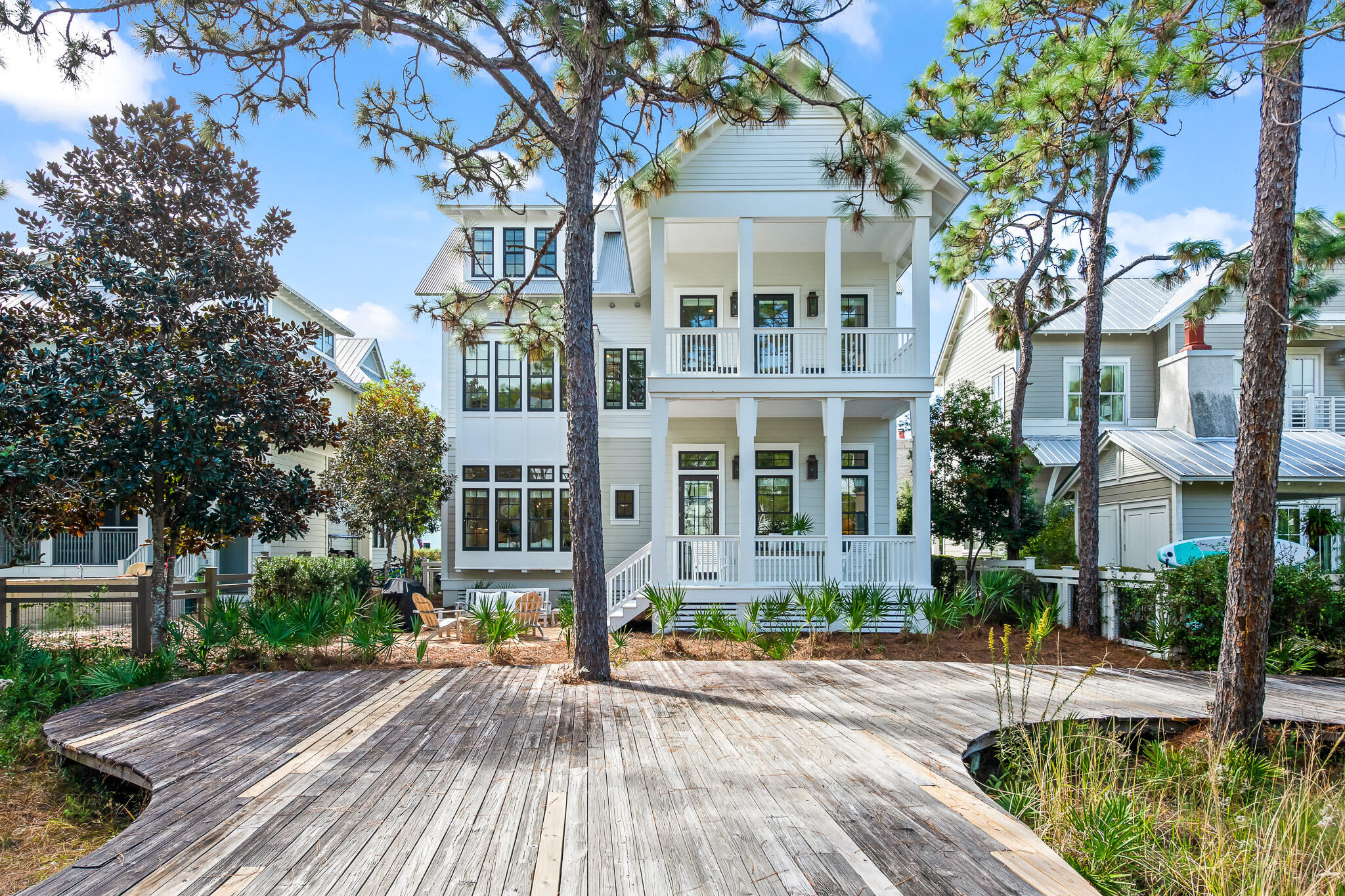 Watercolor Phase III rare opportunity in an idyllic setting near the Boathouse, frog pool and minutes away from the beautiful white sandy beaches of 30a.  First floor is completely new, with new appliances, flooring, cabinets and venetian plaster hood. This home boast 12 ft ceilings first floor with beautiful beams, shiplap,  quartz countertops, real hardwood floors on first floor, new seagrass on third floor room, fireplace, saltwater heated pool, outdoor fire pit, six porches, Wolf six burner stove, sub zero fridge, guest detached cottage with mini fridge and bathroom, one car garage, and a brand new bathroom addition on the third floor. Home is sold completely furnished. Home easily could sleep 14. Buyer to verify all dimensions/Sq footage and HOA dues.