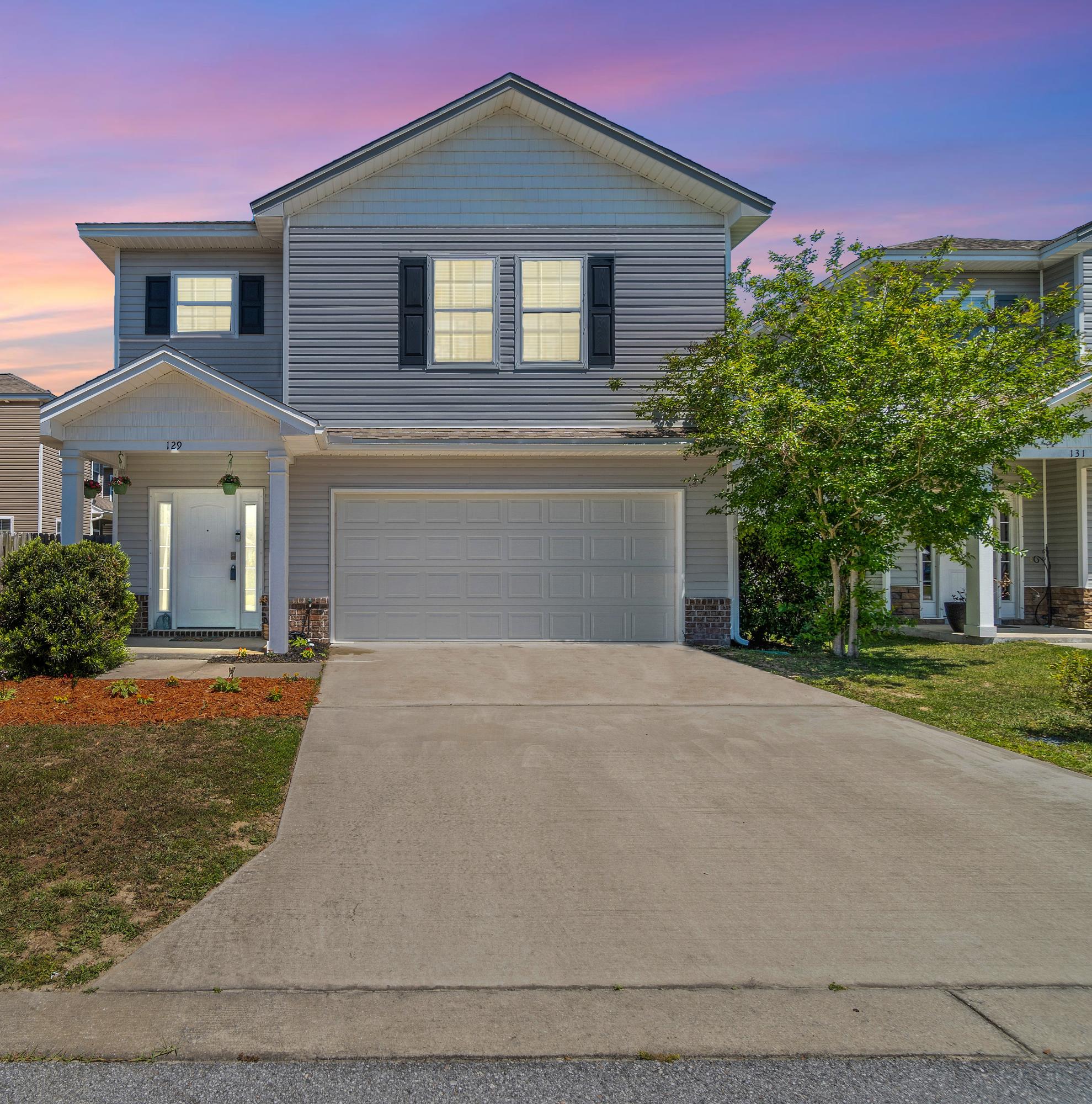 Centrally located in Niceville, near shopping, bases, & beaches! As one enters into the foyer they have the option to go upstairs or continue in to the main living area. The home features a half bath for guests, large open concept living, dining, and eat in kitchen. The kitchen features dark wood cabinetry, stainless steel appliances, LVP flooring throughout. As one makes their way upstairs the primary bedroom includes a large walk in closet, on suite bathroom with separate garden tub, shower, ceramic tile, & cultured marble double sinks. Upstairs also continues with a large laundry room with cabinetry and granite countertop perfect to use as a folding station, & built in sink. There are 3 additional well sized bedrooms and bathroom upstairs. Home features a fenced yard. Show today!