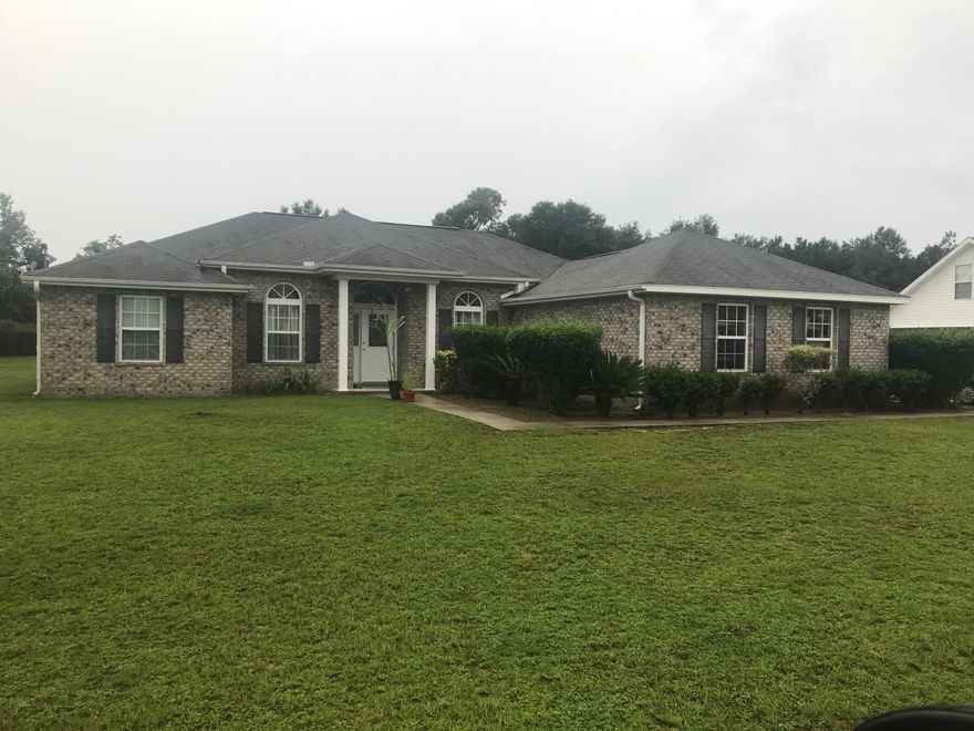 Nice 3BR/2BA all brick home located in the Baker School District. Some features this home offers is vaulted/coffered ceilings, laminate flooring in living area, carpet in bedrooms, title in wet areas, Corian counter tops, 1/2 acre level lot, separate formal dining and office. New HVAC system installed in 2019. Seller is a licensed real estate agent in the state of Florida