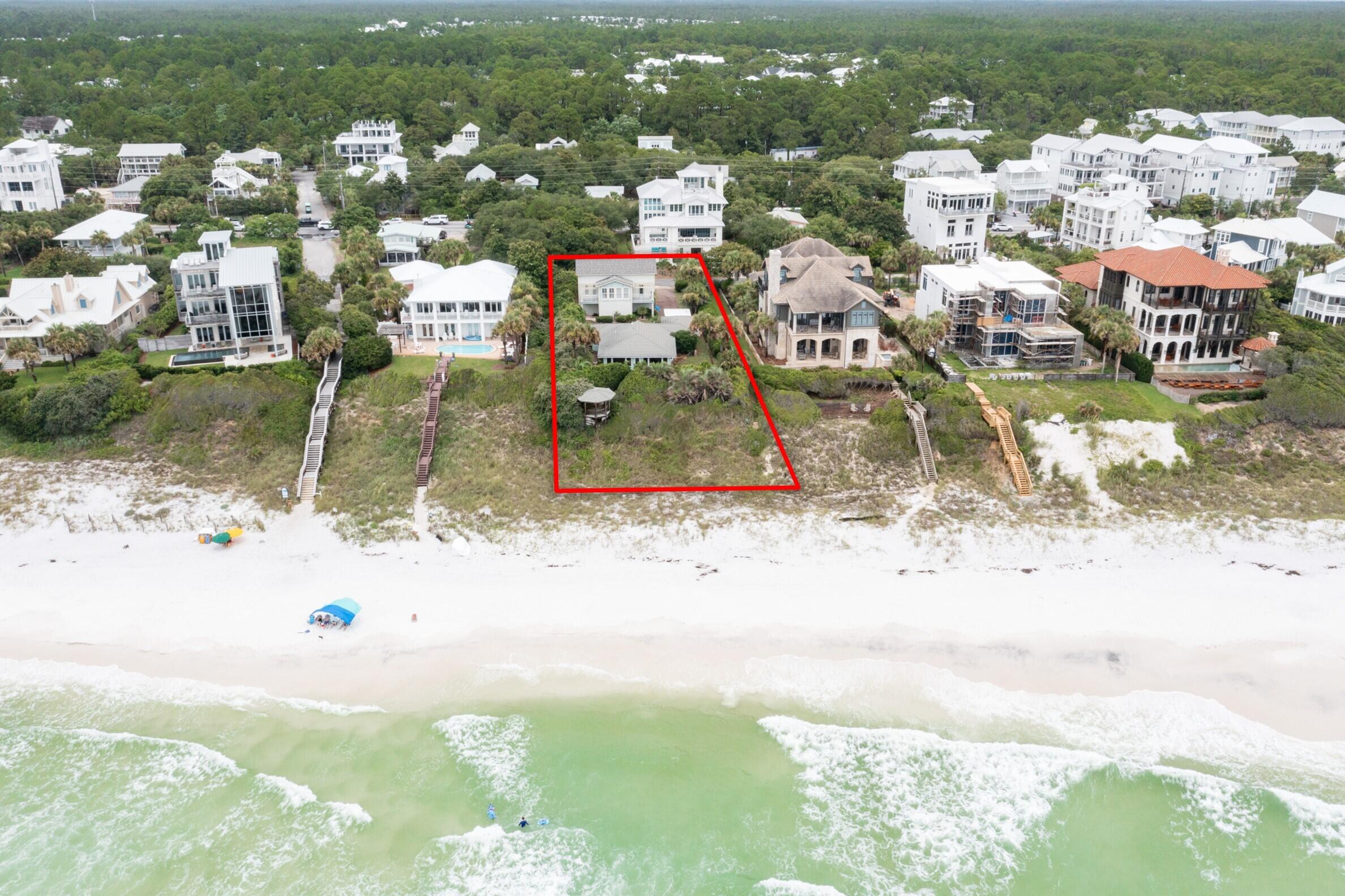 Perched high on the bluff in the desirable Seahighland neighborhood, this exceptional property boasts 87 feet of breathtaking Gulf front views.Explore various opportunities by updating the current home or utilizing the vacant lot to build your dream BEACHFRONT home in one of the most sought-after locations on 30A!Nestled on this lot is a charming 1948 two-bedroom, two-bath house, exuding 1,100 square feet of Old Florida character. The property also features a private gazebo, perfect for enjoying cool breezes and panoramic Gulf vistas from its elevated position.Facing the street, you'll find a modern 2003 carriage house, offering 1,000 square feet of comfortable living space. This includes one bedroom, one bath, a kitchen, a living room, and a dining room, all easily accessible via an elevator. The carriage house also comes with a spacious, air-conditioned garage, two storage spaces, and a laundry room. Enjoy stunning Gulf views from the two outdoor balconies, providing a serene retreat for relaxation. This property has been lovingly built and occupied by the current sellers. Additionally, the location offers convenient access to three public beach walkovers on Montgomery Street, making it a prime spot for beach enthusiasts. ***Buyer is responsible for personally verifying details about this property.  Any information contained in this listing is believed to be accurate but is not guaranteed.***