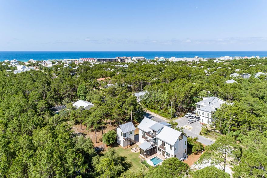 A highly coveted location on 30A's east end, boasting close beach proximity and rare privacy, nestled between WaterSound Beach to the west and Alys Beach and Rosemary Beach to the east. Just 1 mile to Alys Beach. This large custom-built coastal residence with carriage house is offered fully furnished and lends exceptional seclusion, poised on a large homesite that backs up to Camp Creek Golf Course. Enjoy an easy stroll or bike ride to the beach, just at the end of the street.