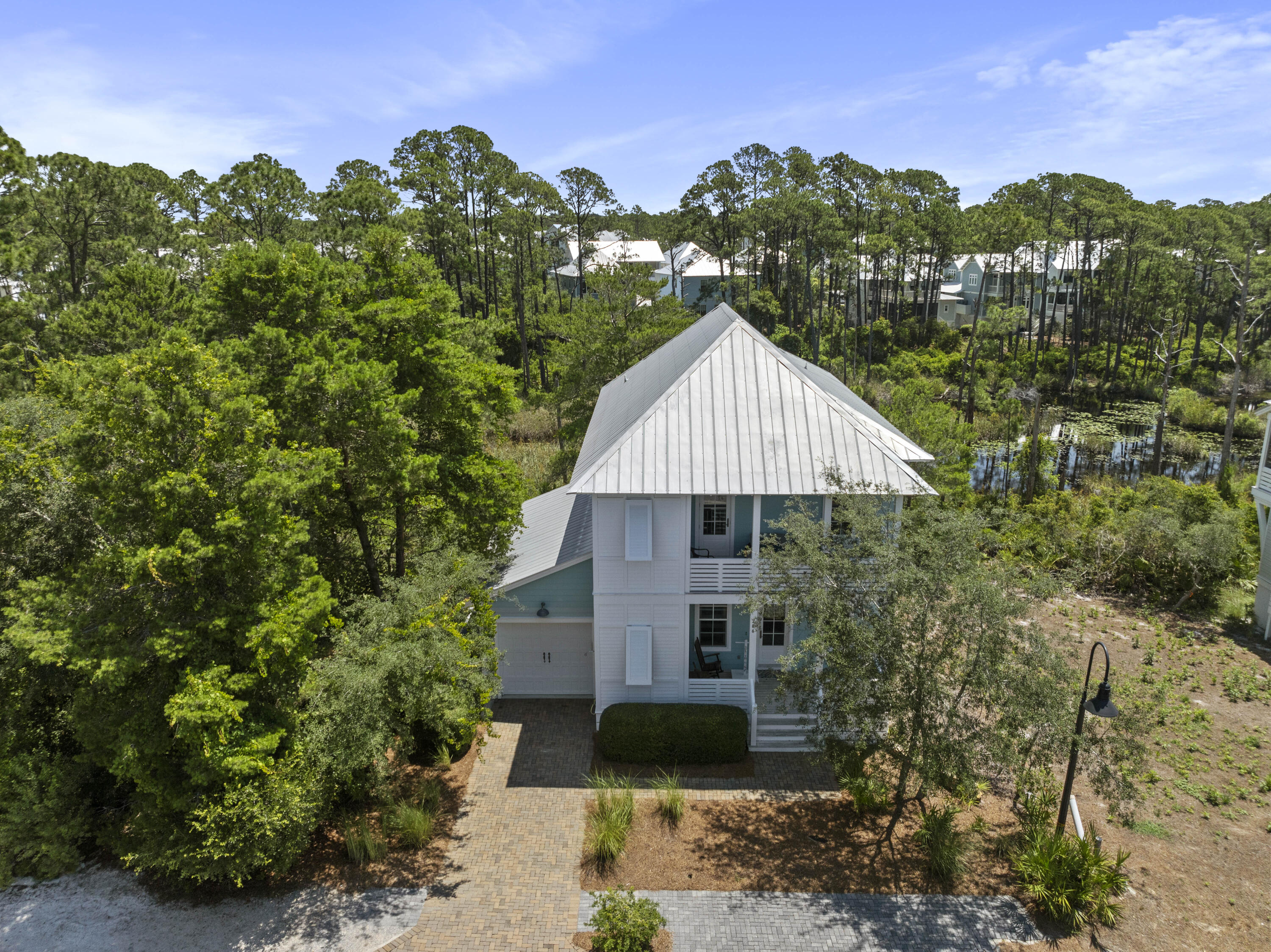 Welcome to Lakeside at Blue Mountain Beach - a perfect coastal retreat.Step onto the inviting front porch and feel right at home. Inside, natural light fills the open floor plan with hardwood floors and a gourmet kitchen featuring granite countertops, a gas range, and a spacious island. A private balcony off the kitchen is ideal for relaxing or grilling.The first-floor master suite includes an ensuite bath and two walk-in closets. Upstairs, enjoy a cozy sitting area, a second balcony, two bedrooms (one with an ensuite), a bunk area, and more outdoor spaces.Backing up to Big Redfish Lake, this furnished, rental-ready home is a short distance to the community pool and Gulf of Mexico. Live the beach life--schedule your tour today!