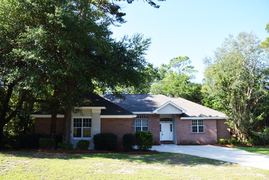 A holiday gift for you, this home has just had a generous price reduction! If a low maintenance home with spacious rooms that 'lives with' your family is your goal, then this home is for you! All brick with Hardi-plank accents, this Huntington contemporary features a brand new dimensional shingle roof (8/15), new wood floors, recent interior paint, and rooms brightened by natural light. The great room, dining room, and kitchen are open to each other for an easy living flow. From the time you enter the front door, your eye will be drawn to the wall of windows in the light-filled great room and then out to the wooded backyard. With the same inspiring view from the bay windowed breakfast nook, you will start every day with a smile. The white cabinets and countertops look fresh and bright.