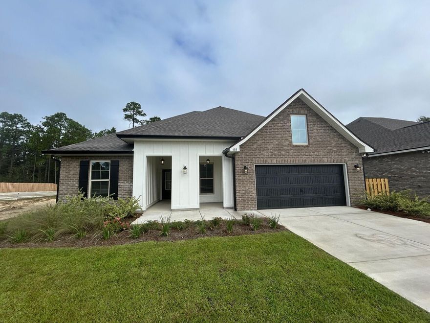 The HICKORY III G in Bird Song at Hammock Bay community offers a 5BR, 3BA, open design with formal dining room and separate den. Upgrades added (list attached).  Features: double vanity, garden tub, separate custom tiled shower, and walk-in closet in master bath, kitchen island, walk-in pantry, covered porches, boot bench, crown molding, recessed lighting, framed mirrors, smart connect WIFI thermostat, smoke/carbon monoxide detectors, landscaping package, architectural 30-year shingles, flood lights, and more!Energy Efficient Features: water heater, kitchen appliance package, vinyl low E windows, and more! Energy Star Partner.