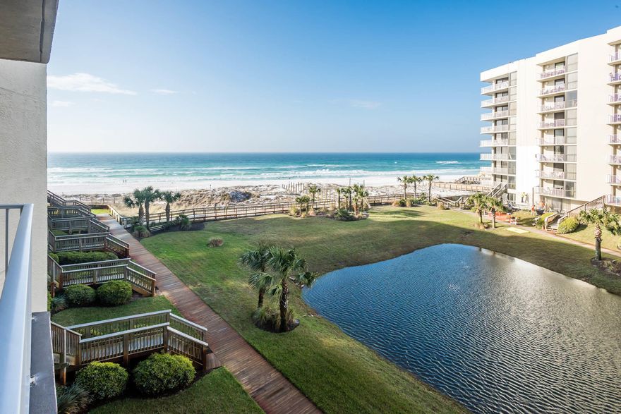 Located in the Gulf-front community of Mainsail, this condominium residence is truly a special find: one of the few four-bedroom condos in the vibrant community. Its position in Phase 1 of the complex lends stunning Gulf views from three of the four bedrooms and beautiful sunsets from both balconies, making it appealing to owners and potential renters alike. Updated features and the condo's unique large sleeping capacity (at least 12 people) provide annual rental income potential of over $58k, with already established income history of +$50,000, appealing to investment-minded purchasers. On the first level of the condo, the living area and master bedroom suite have beautiful Gulf views and access to one of the large balconies facing southwest toward the