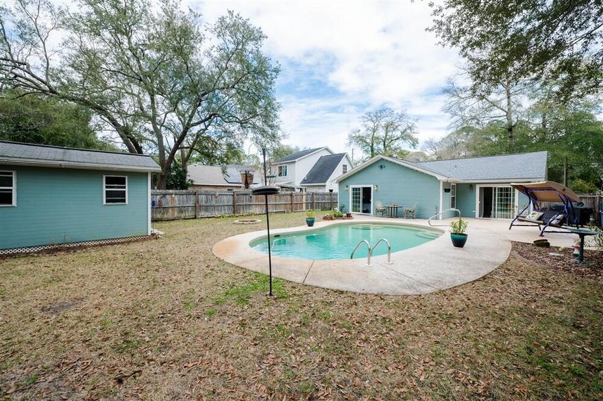 Your adorable Florida cottage with pool awaits!  This immaculate home has 3 bedrooms, 2 full bathrooms and is centrally located and zoned for Niceville schools.  This charmer has been updated with a new hot water heater 2015, HVAC 2018, pool pump 2018, and roof 2019.  The updated kitchen features stainless appliances including a built-in coffee maker with its own water line, recessed and modern lighting, crown molding, low maintenance tile floors, and a bay window which allows for plenty of natural light. An oversized master bedroom includes a dressing area, a walk-in closet, ensuite bath and a walk-out to the backyard. The front bedroom has its own external door, making it ideal for a roommate or young adult. There's an additional room between the foyer and front bedroom that is currently