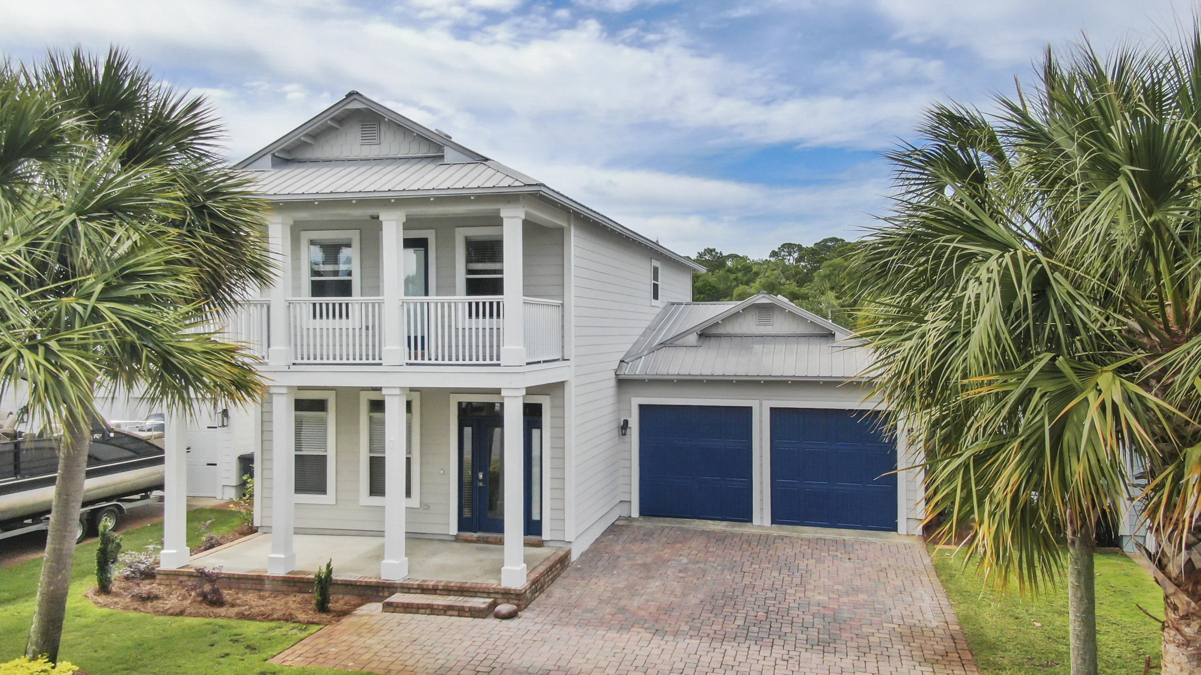 Welcome home to Eagle Bay! This beautifully renovated 2 story single family home is only 5 minutes to the beach! 4 BR/3.5 Bath, unfurnished with new interior and exterior paint and new LVP throughout the entire home. This wonderful home features 2 master suites (1 upstairs and 1 downstairs) with walk in closets and large bathrooms plus 2 additional bedrooms. Step up to the front porch and enter the home where you'll find a spacious dining room leading into a huge kitchen with breakfast bar. Stainless steel appliances, a pantry and tons of granite counters make cooking and baking a breeze. No need to miss the game if you're in the kitchen-it overlooks the family room. Conveniently located off the family room is a patio perfect or grilling or relaxing with a glass of