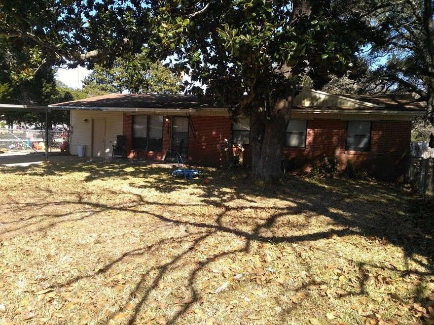 5 to 7 minutes from the beaches. This ranch style brick home has what it takes. Nice corner lot with space for a recreational vehicle if desired. This home has been upgraded a few years ago and now has modern flooring, newer kitchen and an attractive interior. The breakfast room has sliding doors to lead to a fully enclosed patio (20'x 12'. Also sliders lead out to a covered rear porch. Den could be an office or 4th bedroom (without a closet). Spacious laundry room with plenty of space to add folding tables, etc. Master bathroom has a shower unit. The carport is detached with a metal roof. Oversized parking pad extends wider than the carport. One area is chainlink fenced and could be used for that RV or for an additional play or work area. sprinkler system.