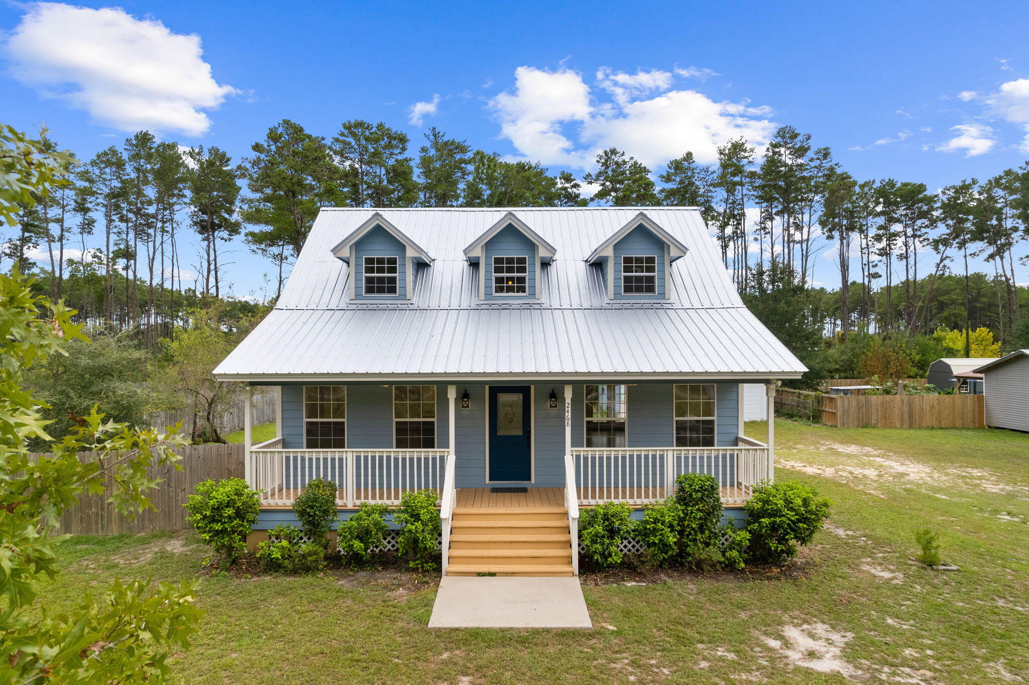 Welcome to this charming fully remodeled cottage situated on a spacious 1/2 acre lot. This property offers a multitude of possibilities, including an oversized detached garage (1000 sq feet) that is perfect for car enthusiasts or those seeking ample space for their hobbies or a work/live space. Step inside from the oversize front and rear porches and be greeted by the exquisite craftsmanship evident throughout. The house has undergone a complete renovation, with attention to detail evident in every corner. The stunning hardwood floors have been meticulously sanded (Australian style) and restained, adding a touch of elegance to the living spaces throughout entire home. Fresh interior paint breathes new life into the home, creating a bright and welcoming atmosphere.