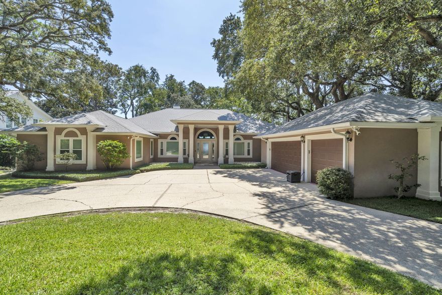 PARADISE FOUND! From the moment entry is made through this gated estate, a sense of peacefulness and tranquility transcends. One is greeted by Majestic Oaks, Magnolias, Pines and Azaleas as the circular drive leads to the handsome, quality built waterfront home where quality meets comfort in perfect style. Every detail from crown molding to garage storage has been lovingly updated and maintained. Magnificent views abound from oversized brand new storm rated windows extending across the entire Intercoastal Waterway/Sound side of the home; and the veranda offers outdoor living to include gas grill, Blackstone griddle & Oni pizza oven,  plus panoramic views of the Sound and a stretch of the undeveloped pristine Santa Rosa Islands ( peeks of the Gulf). The waterfront features ALL NEW SEAWALL, dock decking, metal boathouse roof, boat lift motors and water & electric to the dock. The dock includes a covered boat lift, jet ski lifts and entry ladders for easy access to the water. The interior of the home is equally updated and pristine. Every window was replaced this year with Impact Low E Glass. Rooms are spacious, lighting and fixtures modern, closets customized, and too much more to list. Please see a more complete list under "Documents". You will be impressed.  BIG PLUS, located in Flood Zone X  