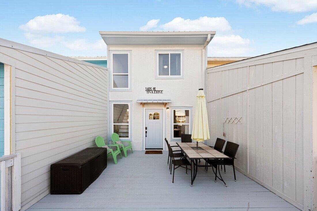Navarre Beach Townhome. NO HOA. Renovated! Short term rental allowed. Just steps from the sugar-white sands of the Gulf of America , fully furnished, 2-bedroom, 2.5-bath. Vacant Easy Show! New 2022 metal roof and 2021 water heater. The open-concept main level features luxury vinyl plank flooring, kitchen with coffee bar, tiled backsplash, glazed countertops, plus a convenient half bath. Enjoy multiple outdoor living spaces with front and back decks, and a private master balcony. Upstairs, the spacious master suite boasts a walk-in shower, while the guest bedroom and full bath provide comfort and privacy. Ideal as a full-time residence, vacation getaway, or short-term rental, this turnkey home offers low-maintenance living in a prime beachside location. See Documents section.