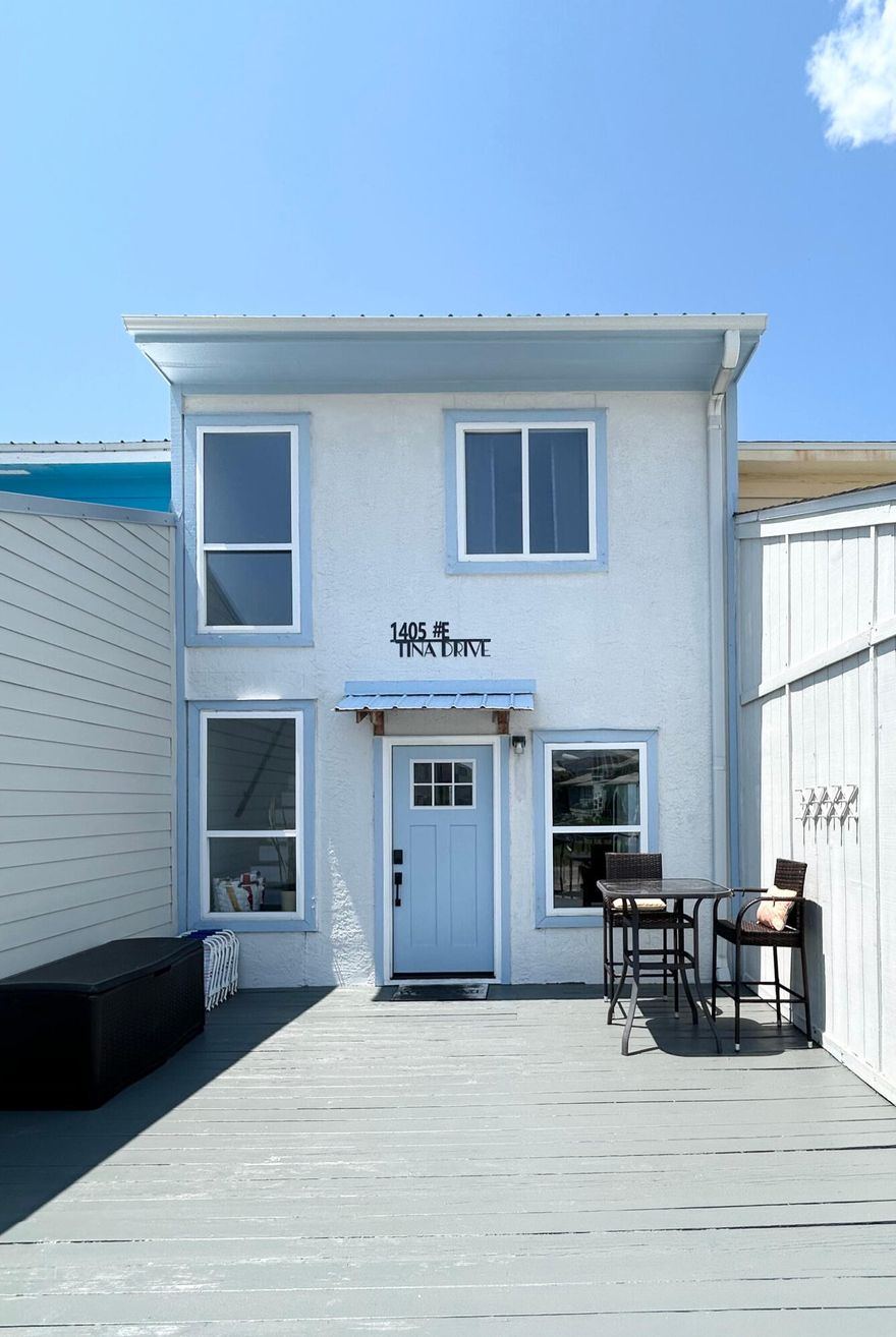 *PRICE REDUCTION* Navarre Beach Townhome. NO HOA. Renovated! Short term rental allowed. Just steps from the sugar-white sands of the Gulf of America and private beach on the sound.  Fully furnished, 2-bedroom, 2.5-bath. Vacant Easy Show!  New 2022 metal roof and 2021 water heater. The open-concept main level features luxury vinyl plank flooring, tiled backsplash, glazed countertops, plus a convenient half bath. Enjoy multiple outdoor living spaces with front and back decks, and a private master balcony. The spacious master suite boasts a walk-in shower, while the guest bedroom and full bath provide comfort and privacy. Ideal as a full-time residence, vacation getaway, or short-term rental, this turnkey home offers low-maintenance living in a prime beachside location.