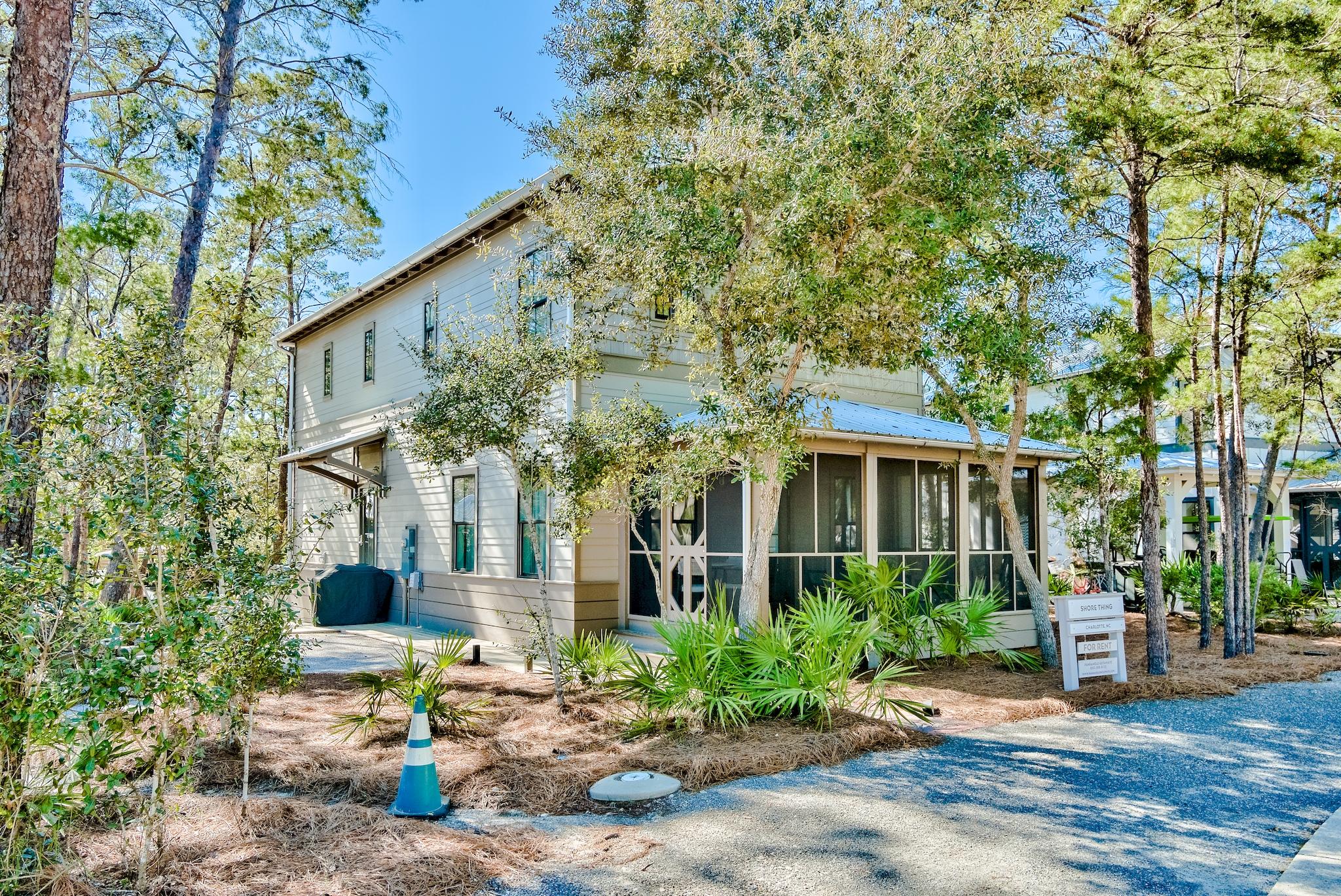 Amazing 4-bedroom beach cottage located in 30A's most charming beachside community, Magnolia Cottages by the Sea. Located just off of Scenic 30A in Seacrest you are close to many attractions, yet tucked away in nature. There is an incredible pool directly across from the home and gated & deeded beach access for the community. This gorgeous beach cottage is beautifully decorated and is being sold furnished, making it the perfect turnkey primary residence, second home, or rental investment. Also included in the sale is a golf cart for an even easier commute to the private beach boardwalk. This home boasts 2,160 sq. ft. and features two true master bedrooms, one upstairs and one downstairs! You are welcomed by the beautiful curb appeal, paver walkway, and spacious screened-in porch with fan. The exterior also offers a convenient outdoor shower at the side entry, a private outdoor shower off the upstairs master, cozy firepit, and an attached shed for storage. Inside you are greeted with a spacious open floor plan, raised ceilings with crown molding, designer light fixtures, and engineered hardwood & tile floors throughout. The living & dining areas feature lovely wainscoting and are nice and bright with recessed lighting & several windows allowing in plenty of natural light. The kitchen features Quartz countertops, large breakfast bar, gas range, farmhouse sink, subway tile backsplash, and stainless steel appliances. Just off the kitchen is a half bath with a chic barn door & shiplap wainscoting, convenient for visiting guests. Both master suites are spacious and feature a shiplap accent wall, king bed, recessed lighting, crown molding, mounted flat screen TV, walk-in closet, and an en-suite master bath. The downstairs master bath has a chic barn door, shiplap wainscoting, a double vanity with Quartz countertop, and a lovely walk-in tile shower. The upstairs master bath features Quartz countertop, shower/tub combo with subway tile surround, shiplap wainscoting, and direct access to a private outdoor shower. This feature is truly unique - enjoy a rain shower while looking up at the trees. Stones surround the wooden shower and there is a built-in bench too. Both guest bedrooms are generous in size and feature en-suite bathrooms. One guest bedroom offers two sets of twin bunks maximizing the sleeping occupancy and an en-suite bath that features Quartz countertop, shiplap wainscoting, and a shower/tub combo with subway tile surround. The other guest bedroom features a king bed and an en-suite bath with Quartz countertop, shiplap wainscoting, and a beautiful walk-in tile shower. The staircase is accented with shiplap as well and features an owner's closet underneath. This home is immaculate with unique features, beautiful finishes, open floor plan, and is a great investment. 

Magnolia Cottages by the Sea offers great amenities such as a zero entry pool with large sundeck, a green space area for activities like volleyball, deeded beach with private boardwalk and golf cart parking. Both the pool and boardwalk have new electronic gates. The community is charming with its lush foliage, tropical landscaping, and brick paver streets. Magnolia Cottages is a very desirable neighborhood just west of upscale communities Alys and Rosemary Beach with local dining, shopping, and entertainment nearby. 