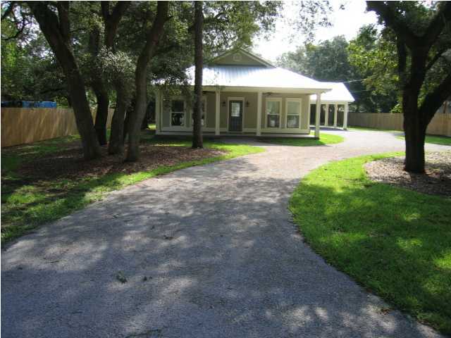 A beautiful must see home with all the nicest high end touches. Floors are hardwood in the living area, large laundry/office space, kitchen has bead board cabinets, master bedroom and bath are at the back of the property with separated shower and jetted tub and split from other two bedrooms. Front and back porches and carport ceilings are tongue in groove wood with ceiling fans, awesome trees, dog fence in back yard and privacy fence on perimeter of lot. Seminole is zoned agricultural and these large lots offer a ton of choices for owners. Home is zoned for Bluewater Bay Elementary and convenient to Bluewater Bay, Destin's Mid Bay Bridge toll road and Eglin reservation. Very close by is the EOD school! Great house, awesome location and move in ready.
