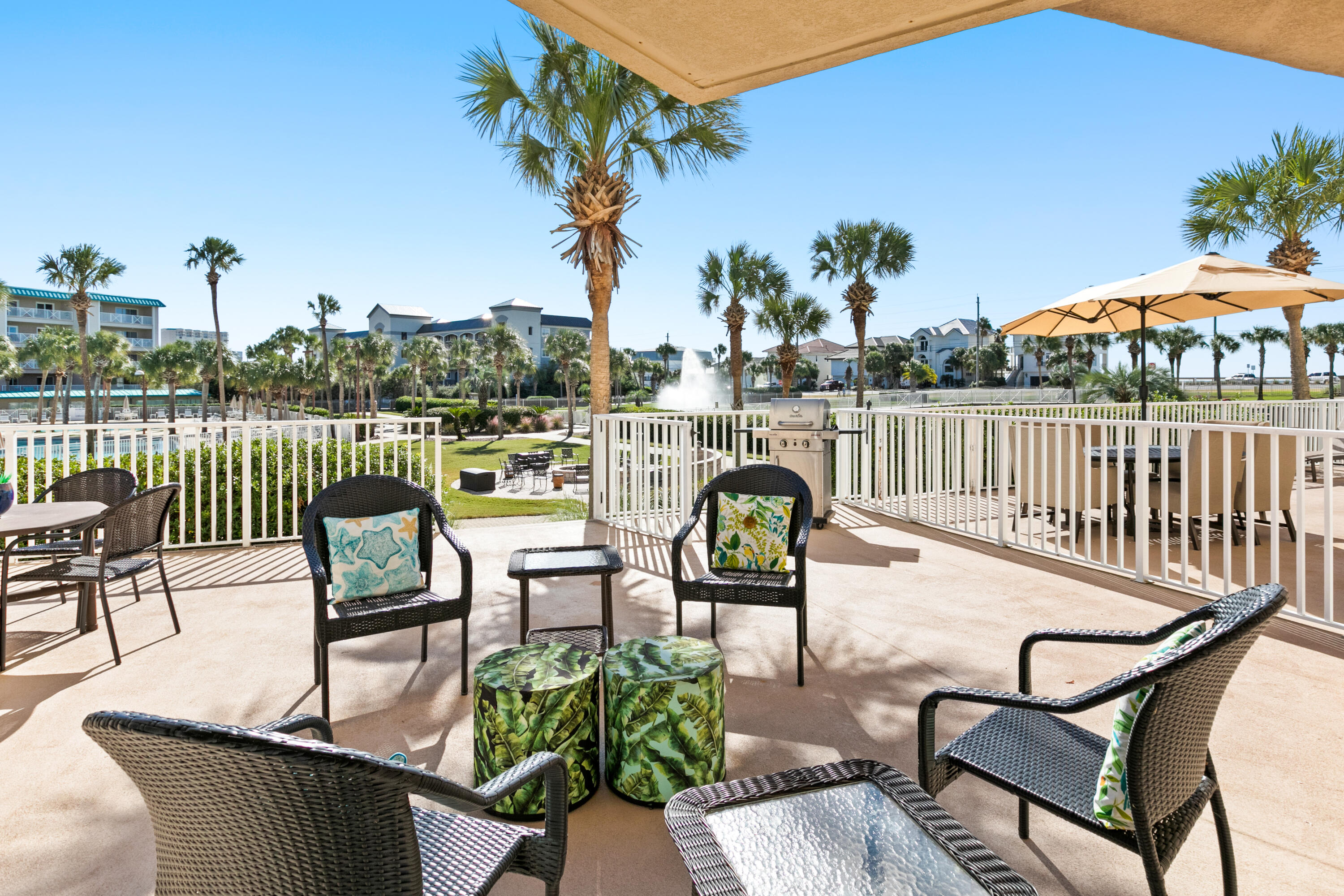 This one of a kind unit features a 25x20 terrace with gate and steps leading to the pool and beach at Amalfi Coast Condo. Grand in size at 1075 SF; the balcony makes this over 1500 of living space! Huge main suite bedroom plus hall trundle bed, sleeper sofa and 2 FULL baths. Unit has been upgraded with furniture, flooring, appliances, water heater and HVAC system. $25,000 value deeded garage parking space included and plenty of overflow parking. Owners enjoy locked storage rooms for bikes, paddle boards and kayaks. Used sparingly as a second home and sold turn key fully furnished with all accessories. Two pools, one heated. Two lighted tennis courts. Fitness center and clubhouse. All on 8 1/2 plush landscaped acres securely fenced and gated for the utmost privacy. Pet friendly for owners.