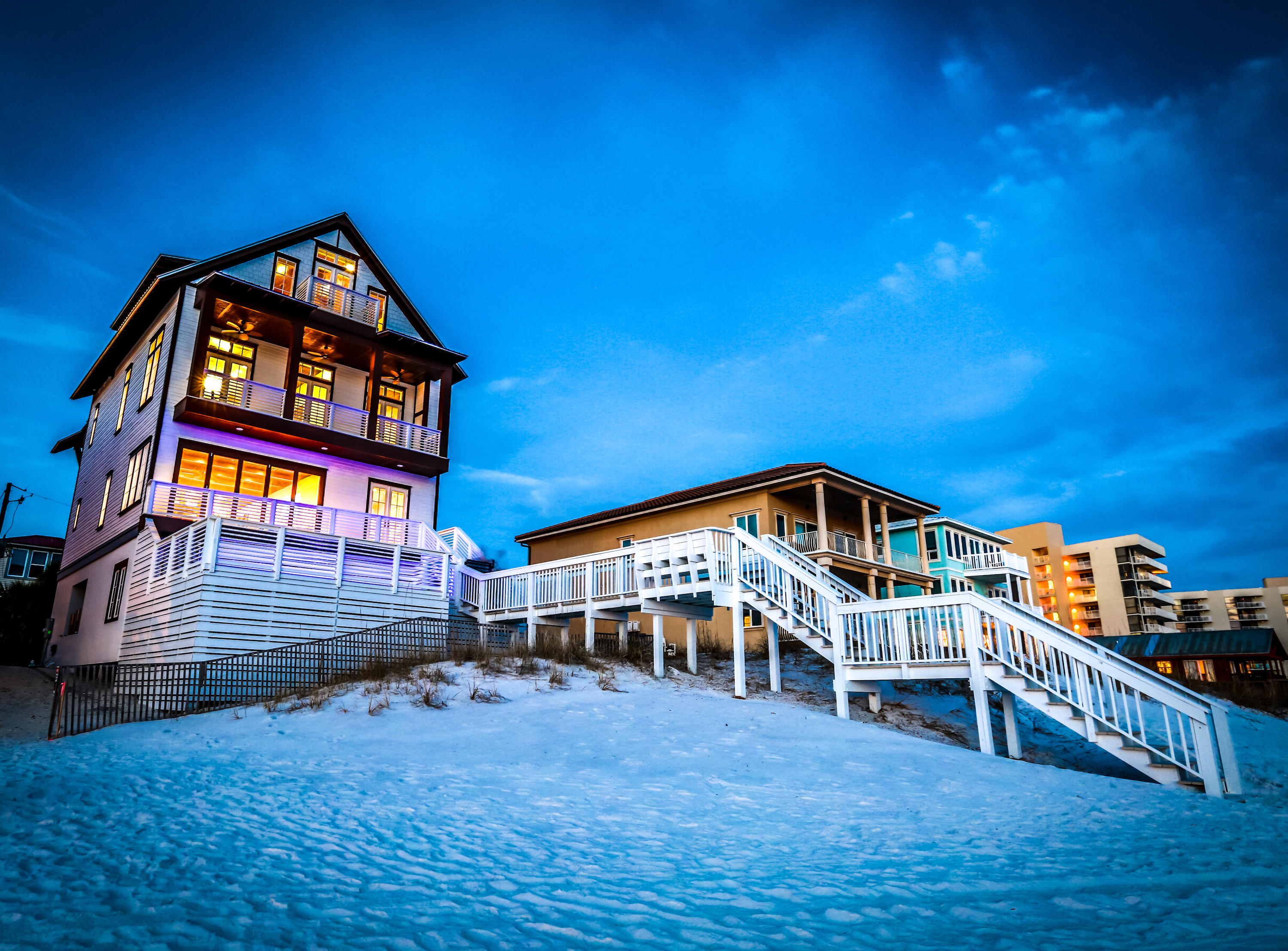 2014-built, beachfront rental winner with a private, beachside pool, distinctive interiors, ownership to the water, and room for a crowd. Perched high above sugary white sands, ''Kate's Porch'' captures breathtaking views of emerald waters from its 4 stories of Gulf-front balconies. The interior's warm, neutral tones and natural materials like wood ceilings and stone tile frame breathtaking views of vivid emerald green waters. Designed for large groups of family and friends, the floor plan provides privacy and convenience in 2 ample-sized living rooms, an attached guest suite with private entrance, 3 master suites, and a 1st-floor wet bar with beverage center. The king master suite encompasses the entire 3rd floor.