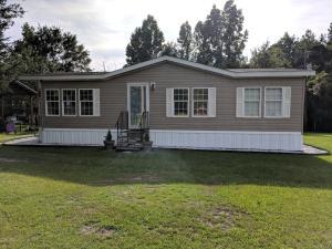 A very nice, quite, clean, 2013 double-wide mobile home on 40 acres. A pole barn is being utilized for parking. The property is nicely landscaped around the mobile home. A small storage building is also located behind the mobile home. A portion of the 40 acres is wooded. This property is a hunter's paradise!