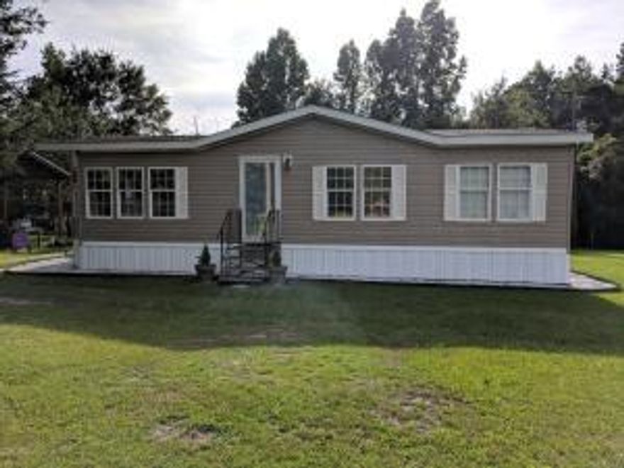 A very nice, quiet, clean, 2013 double-wide mobile home on 40 acres.  A pole barn is being utilized for parking.  The property is nicely landscaped around the mobile home.  A small storage building is also located behind the mobile home.   A portion of the 40 acres is wooded.  This property is a hunter's paradise!