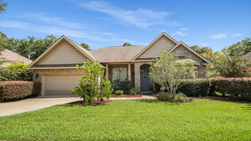 Welcome to 462 Mango Lane, a meticulously maintained all-brick home located in the highly desirable Orchard neighborhood at Hammock Bay. This 3-bedroom, 2-bath residence also offers a dedicated office with French doors and bay window, perfect as a private workspace or optional 4th bedroom. Step inside to discover an inviting open floor plan filled with natural light and stylish upgrades. The main living areas feature beautiful hardwood and tile flooring, while the kitchen is a chef's delight with stainless steel appliances, granite countertops, and abundant cabinetry. Entertain in the formal dining room or gather around the bar-top seating for casual meals. The spacious primary suite easily accommodates oversized furniture and includes a sitting area with direct access to the screen in  back patio. The ensuite bath is designed for relaxation with double vanities, a soaking tub, and separate shower. Enjoy peaceful views and privacy from the large backyard that backs to a tranquil preserve and lake setting. Pride of ownership shines throughout this home, inside and out. Living in Hammock Bay means resort-style amenities at your fingertips, including pools, fitness center, clubhouse, pickleball, tennis, walking trails, and moreall within a master-planned community just minutes from the beaches of the Emerald Coast. Don't miss your opportunity to own this exceptional property in one of Freeport's most sought-after communities!