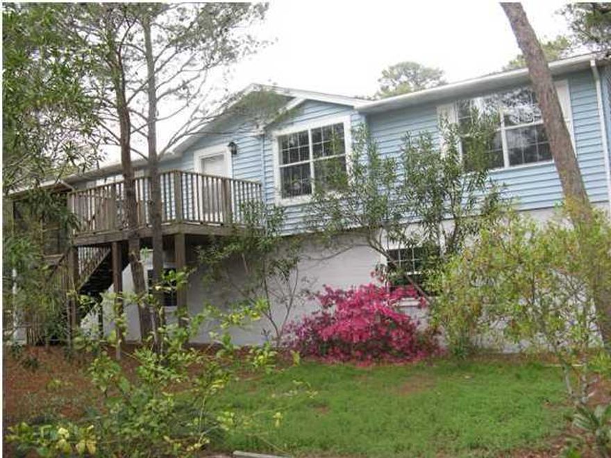 Peaceful setting on a large lot in Inlet Beach. The foundation & first floor of the house are concrete block filled with cement & reinforced with rebar. First floor consists of a 2 car garage & an area that was originally going to be a 1 bedroom/1 bath mother-in-law suite-ready to be finished. Or you could have a 4 car garage. Second floor is a split floor plan with 1,200 sq.ft. heated/cooled area, consisting of a living area, kitchen, 3 bedrooms & 2 baths.Two of the bedrooms have access to an oversized screen porch. There is a Cullagan water filtration system. New roof installed Nov 2011 with a 30 yr warranty. Well pump & water storage tank replaced Jan 2015. 4/10 of a mile to the Walton County Public Pier on Lake Powell. Room dimensions are approximate, please verify, if important.