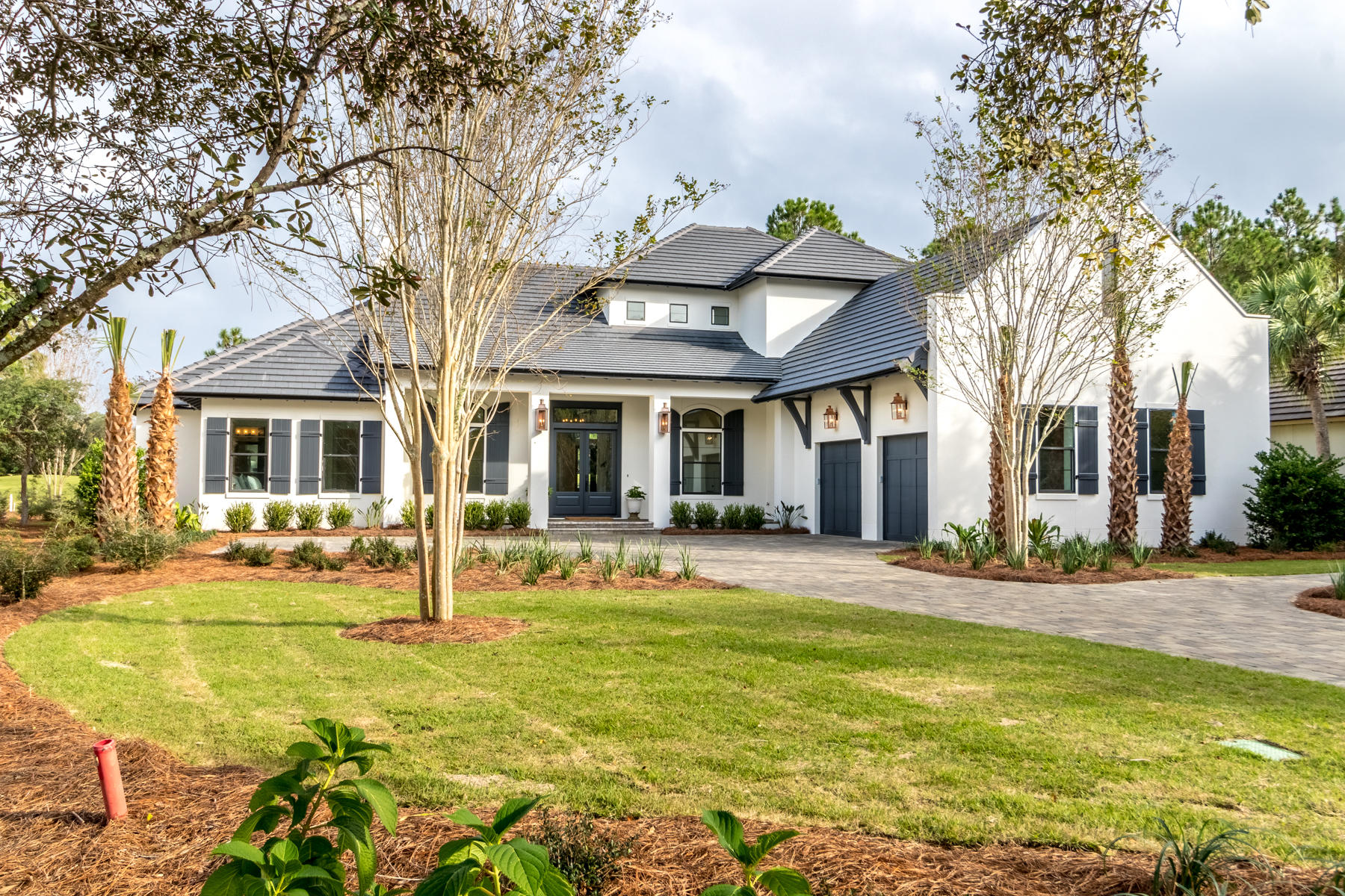 Located on the 7th hole of the Raven golf course, with its high ceilngs and clean lines this Alys Beach inspired home is one of the newer built homes in Burnt Pine . Located in the exclusive Burnt Pine community of Sandestin, the open floor plan features four bedrooms and a separate office. Natural light floods the house in every room. Relax in the master suite where you have cathedral beamed ceilings and a master bathroom right out of a magazine. The master bathroom exudes relaxation with ship lap walls,a custom bathtub, split vanities, a makeup area and large walk-in shower. The separate his and her closets complete the master suite. The kitchen features a separate refrigerator and freezer,2 dishwasher drawers, ice maker, & two sinks and an