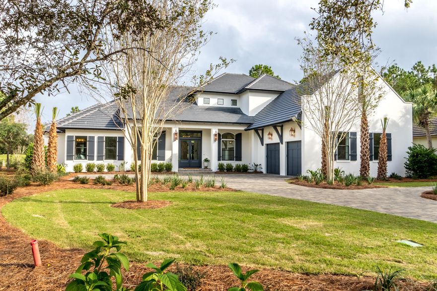 Located on the 7th hole of the Raven golf course, with its high ceilngs and clean lines this Alys Beach inspired home is one of the newer built homes in Burnt Pine . Located in the exclusive Burnt Pine community of Sandestin, the open floor plan features four bedrooms and a separate office. Natural light floods the house in every room. Relax in the master suite where you have cathedral beamed ceilings and a master bathroom right out of a magazine. The master bathroom exudes relaxation with ship lap walls,a custom bathtub, split vanities, a makeup area and large walk-in shower. The separate his and her closets complete the master suite. The kitchen features a separate refrigerator and freezer,2 dishwasher drawers, ice maker, & two sinks and an