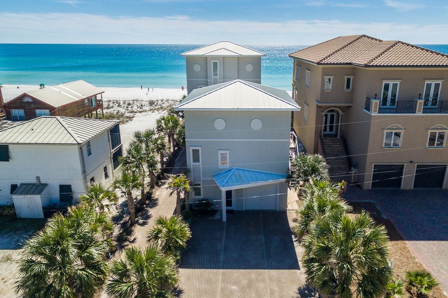 Old Florida living meets today's coastal design. Comprised of 2 homes, the fully renovated Gulf Splendor masters beachfront living. The gulf front, 4-story beach house provides endless gulf views and the 3-story guest house on the street side offers additional space along with corridor views of the gulf. Both homes include private swimming pools.From the second-floor living space of the beach house your eyes are immediately drawn to the wall of large windows and the emerald green waters beyond. Open concept with a light and airy feeling, the living/kitchen/dining/wet bar is a natural gathering space. Open the French Doors and let in the warm salt air breeze or step out onto the deep balcony. The living room features a gas.. fireplace surrounded by built-in shelves. The newly updated kitchen features white cabinets, a quartz countertop and new stainless steel appliances. New hardwood flooring is strikingly present in both homes. The third floor has 2 gulf front bedrooms complete with private baths and a shared gulf front balcony. A bonus area on the third floor has been made into a bunk room, but can easily be converted to an office space. The entire fourth floor is a master retreat fit for a king, complete with a sitting area, wet bar with a wine fridge, walk-in closet, a private bath with dual vanities and an oversized walk in shower, and a private balcony.  All floors are easily accessed by the elevator. The first-floor area has an owner's closet and laundry room with access to the private pool and outdoor covered patio area. The patio area has a BBQ and a bar area complete with a fridge. 
Gulf Splendor's guest house has 4 bedrooms and 4.5 baths. The main floor has a bedroom with private bath. The second floor is an open concept living, dining and kitchen area, all newly renovated. The living room also has a wet bar area complete with a wine fridge and sink. Step out onto the balcony from the second floor to a private pool and gulf views. There is also a half bath and laundry room on the second floor. The third floor has 3 bedrooms. The front 2 bedrooms have gulf views and private baths with the third bedroom being a bunk room with private bath. 
Call today for a private showing.
