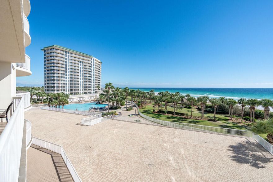 This beautiful gulf front unit is located in St Maarten at Silver Shells. Unit 404 is located in the desired center stack of the building, that offers unobstructed panoramic views of the pool area and the beach / gulf. The level of this unit offers perfect views of palm trees, white sand, and blue water. This unit just had a major remodel, in 2022, that removed walls to offer an open living concept, new cabinets, granite tops, tile flooring that looks like hardwood throughout the unit (not a vinyl plank), and lots of new furniture and appliances. A semi-private elevator opens directly into the unit and the unit has an assigned parking space, in the garage, just steps away from the elevator. The gulf front primary bedroom has direct access to the balcony, with beautiful views of the beach .