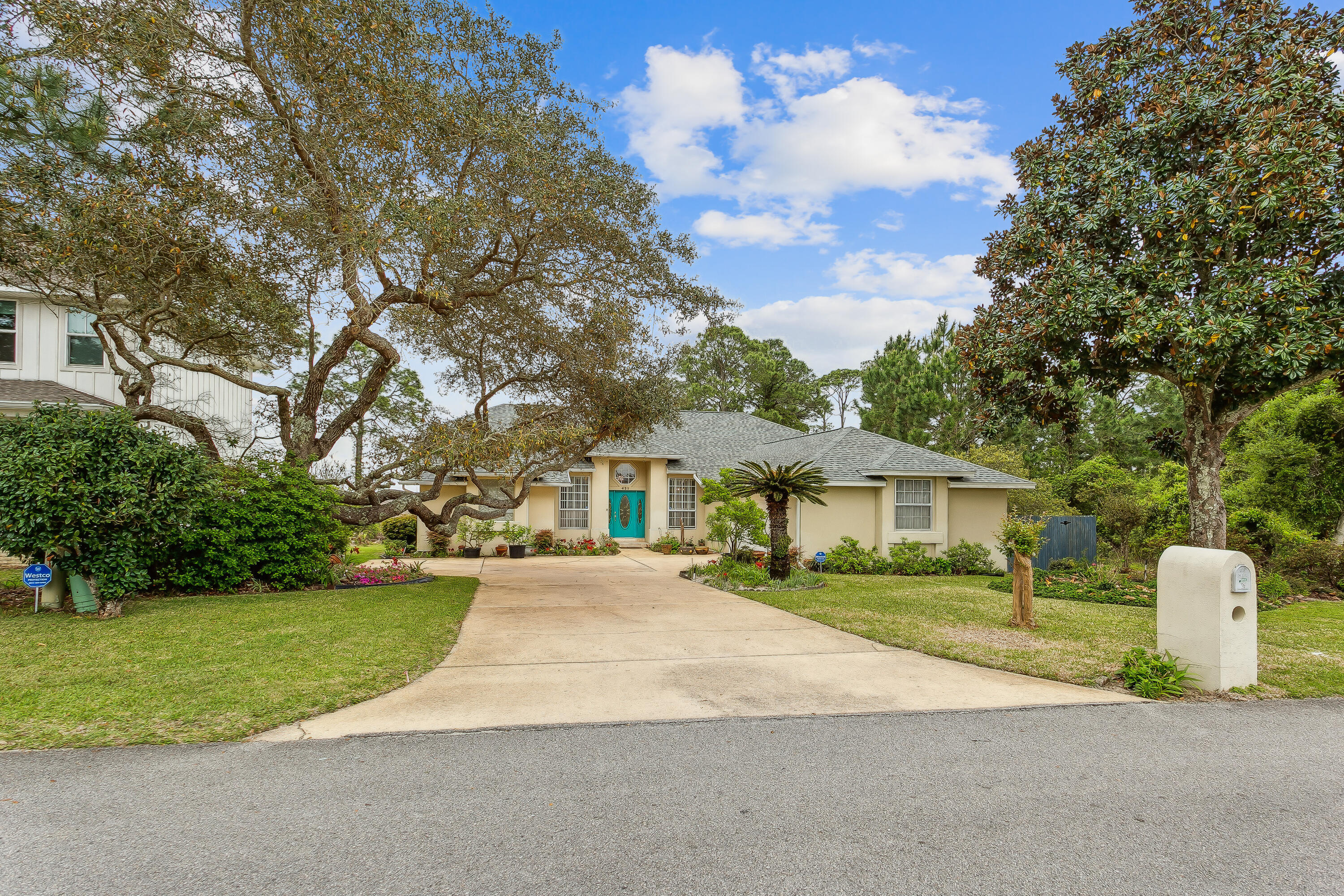 Out of this World Location! South Side of Hwy 98 - Emerald Pointe Subdivision is a quaint neighborhood that has deeded waterfront access to the Sound ** This property is within driving distance of  Navarre Beach's Stunning White Sands &  Eglin AFB & Hurlburt Field. This gorgeous home overlooks the natural beauty and terrain of the property behind. Sit in your sunroom and take in the tranquility and views of nature and Santa Rosa Sound** Fabulous kitchen with many custom features....granite counters & surround, cherry cabinets offering loads of pull out drawers for easy access, upgraded stainless appliances w/ Fisher & Paykel double drawer dishwasher & 5 burner gas stove, separate wet bar with wine rack and a built in desk area. 10' ceilings in dining areas, kitchen, living area & master suite make this home have a super spacious feel. Split plan offers private master suite with huge bath...relax in the large whirlpool tub. Double vanities, separate shower, walk-in-closet plus separate water closet too. Stunning Travertine and Brazilian Acacia wood floors The oversized side entry garage offers a heated/cooled workshop area. Situated on a very quiet and private lot with water views and water access...what are you waiting for? ** Total square footage includes the Florida Room ** Must belong to the voluntary HOA to utilize the deeded water access ** Please refer to aerial for an outline of the property boundary lines.