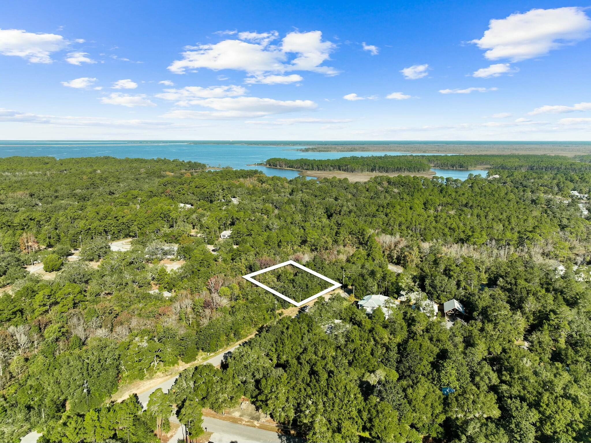 Discover the perfect opportunity to own a slice of paradise in the highly sought after Point Washington neighborhood.  This ideally located lot is just a few blocks from the public boat ramp, making it a haven for boating and fishing enthusiasts.  Nestled in a quiet, peaceful community, this property offers a tranquil retreat while still being only a couple of miles from the stunning beaches of 30A.  Whether you're looking for a promising investment, a site for future home, or a dependable long-term rental opportunity, this lot checks all the boxes.  Don't miss your chance to secure this rare gem in one of the area's most desirable locations!