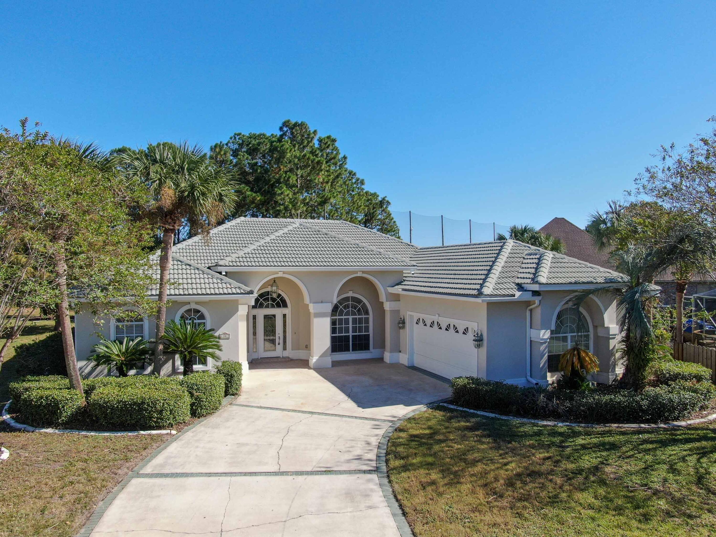 Beautiful move-in ready home nestled on a quiet cul de sac in the desirable Baywinds Golf Estates of Destin! This large property features a curved driveway, two car garage, and large entry. Once inside you will be met by a spacious foyer, formal living room, and formal dining room with built-in shelving. Past the formal living area you will find a spacious family room which opens up to the kitchen, complete with an inviting fireplace and breakfast bar. Split bedroom layout for added privacy. HUGE master suite with walk in closet. Large back yard area. Fresh paint, new stainless steel appliances, new granite counter tops, new LG washer/ dryer and new carpet throughout. Gated community! Community pool. Pet restrictions apply. Agent notes!