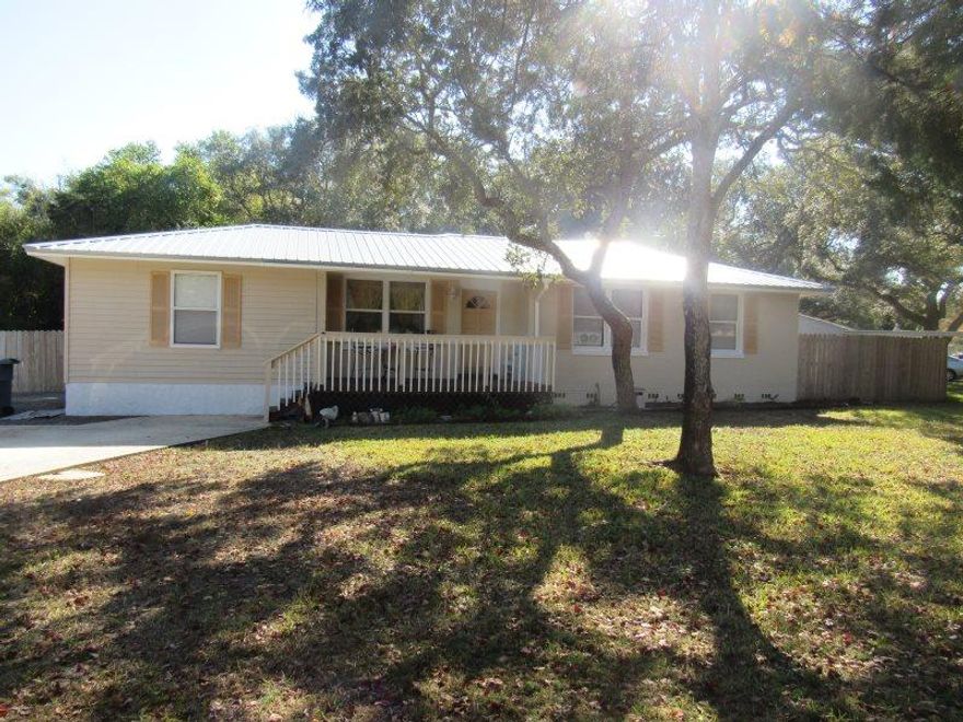 Older home on large corner lot that shows extremely well. Hardwood floors have been refinished. Kitchen has an open pantry and has been remodeled with custom built walnut cabinets to include a built in spice rack and LED under counter lighting. Master bedroom has a walk in closet. Master bath has a garden tub and separate shower. Exterior freshly painted. New metal roof installed October 2016. Hot tub on rear screened porch. Pond and fountain out back. Open wood deck for grilling and entertainment. separate storage building with electricity. DON'T WAIT, YOU'LL BE Too Late...