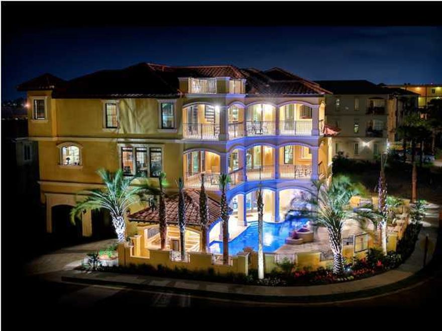 Come and View this one of a kind Masterpiece of a Property!! This Magnificent Home has been Professionally Furnished with such Style & Class. Featuring Private Sun Deck, Heated Pool/Spa w/Waterfall, Lanai, Rec Room,2 Master Suites, Elevator,Outside Kitchen area, and Sleeps 25-29 guests which makes for a Great Vacation Rental!! There is 806 Sq.Ft. of Balconies all with views of the Gulf of Mexico, 137 Sq.Ft. Private Sun Deck that has a Spiral Stair access from the 3rd Floor Balcony. The first floor has 2 bedrooms, a great living and entertainment area that opens up to the spacious pool with views of the gulf..pool has built in stools in the water that overlooks the outside Bar & Grilling area. 2nd Floor has a Very Large Gourmet Kitchen with a wonderful island for sitting,cooking, &