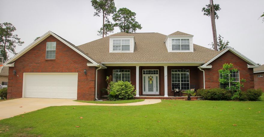 HOME WARRANTY INCLUDED: This elegant home with many custom features is available in the desirable Bayshore Place Subdivision of Niceville. This upscale subdivision requires NO HOA dues and is maintained impeccably! The home was built in year 2005 with 2840 sq ft, 4 bedrooms, 3 baths, and an attic bonus space that can be finished to add additional heated and cooled sq footage! Extra boat/trailer parking available behind the privacy fence! Enter into a large foyer through leaded glass front doors and notice a very open floor plan, with cased openings to the right leading to a large office and cased openings to the left leading to a formal dining room! In addition, a large open living room space is visible from the foyer.