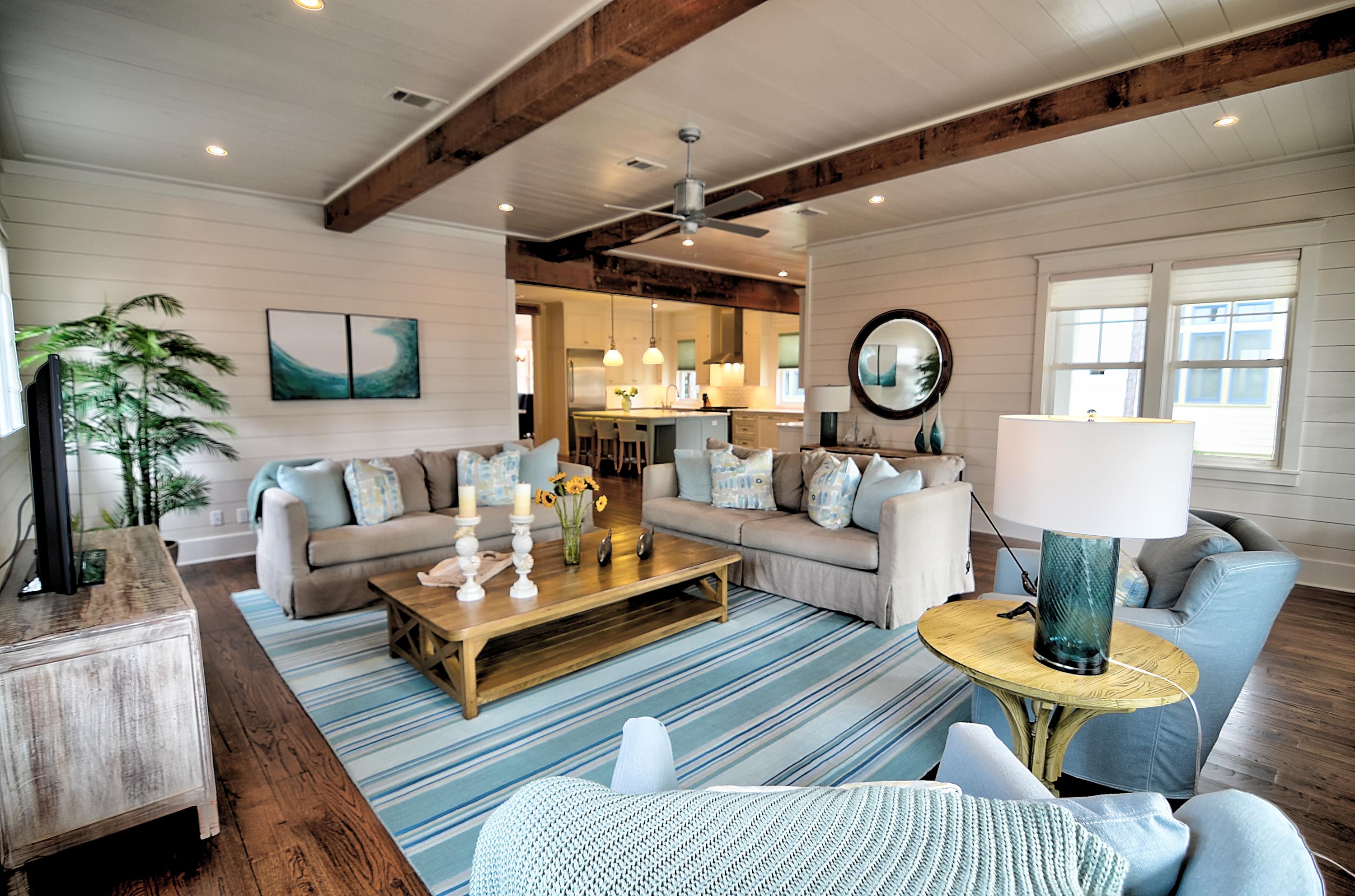 Tucked away in the vibrant community of Watercolor, this custom built, 5 bedroom, 5 -1/2 bath, 2-story home sits on beautiful lot in Phase II. Backing up to the natural preserve, this home just across the street from a small park and a short walk to Camp Watercolor. This home eases into its natural surroundings with Ipe decks, an expansive front porch, screened in back porch, outdoor shower and a fenced in back yard all showcasing outdoor living at its finest and priced to sell! Ideal for entertaining, as you step into the entryway, you are welcomed with an open floor plan custom oak floors and 10 ft ceilings that showcase cypress wrapped beams and custom designed furnishings, all of which convey with purchase. A chef's dream kitchen highlights Thermador applicances and Calcutta marble