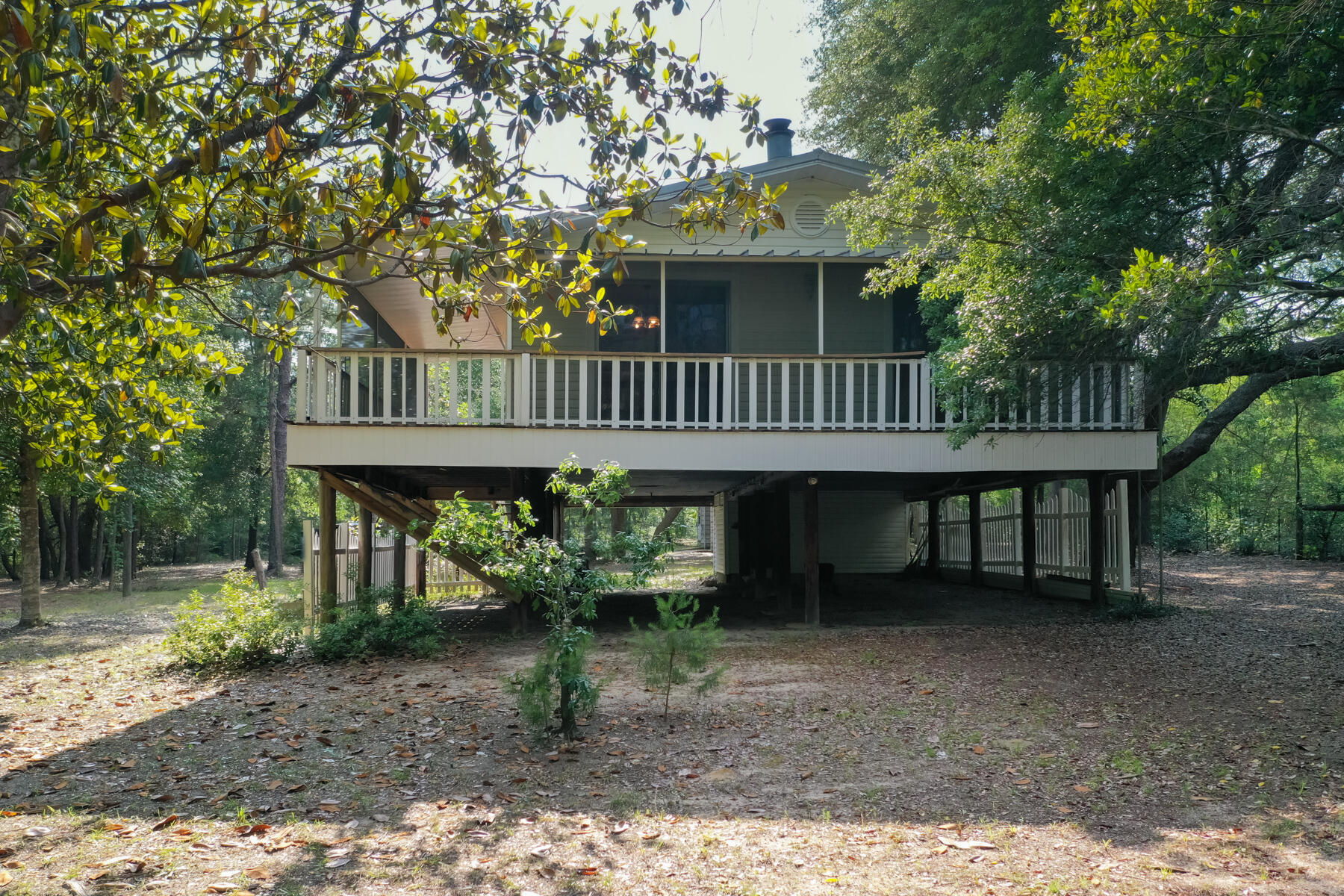 Welcome to 4352 Loping Deer Rd. in Holt, Florida! This charming property boasts 2 bedrooms, 1 bathroom, and a total of 1.84 acres spread across three parcels (10-2N-25-0000-0006-0170, 10-2N-25-0000-0006-0710, 10-2N-25-0000-0006-0670).The interior has been recently updated with fresh paint, new commercial grade vinyl plank flooring throughout, and upgraded fixtures. You'll enjoy a newly refinished tub/shower, new vanity, and a new toilet. Additionally, all light switches and outlets have been replaced, and new HVAC exhaust vents have been installed.In addition to all the recent updates, this property also features a charming wrap-around porch, perfect for enjoying your morning coffee or watching the sunset.This home features a beautiful metal roof (2012), new septic system (2021), ..