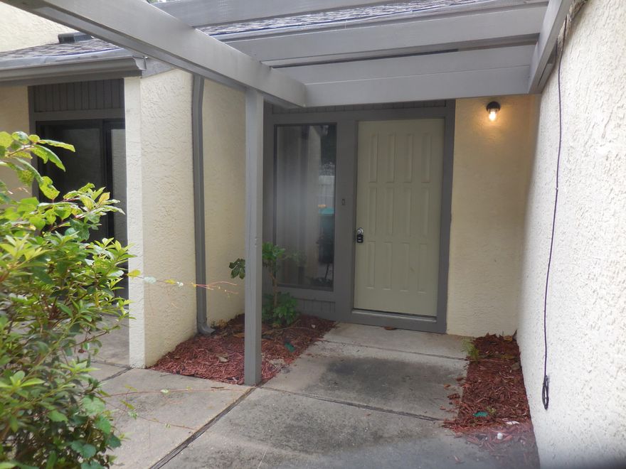 REO. Wonderful End Unit! Large vaulted living room, 2 dining areas, 3 open patios AND a screened in patio! Newly painted, new carpet, new counter top, new stainless steel smooth top stove/oven, range hood, and dishwasher, new garbage disposal, new light and plumbing fixtures and mirrors, new i/o carpeting, screen door and ext fan/light in patio, new fan/lights in bedrooms. Wow, what a find! This 2 bedroom, 2 bath townhome is handled like a condominium...your HOA dues cover exterior maintenance, WDO and Termite Coverage, exterior building insurance and lawn services past the 10' mark...almost carefree living, yet you own the land you live on! Don't Wait, Don't Miss Out!