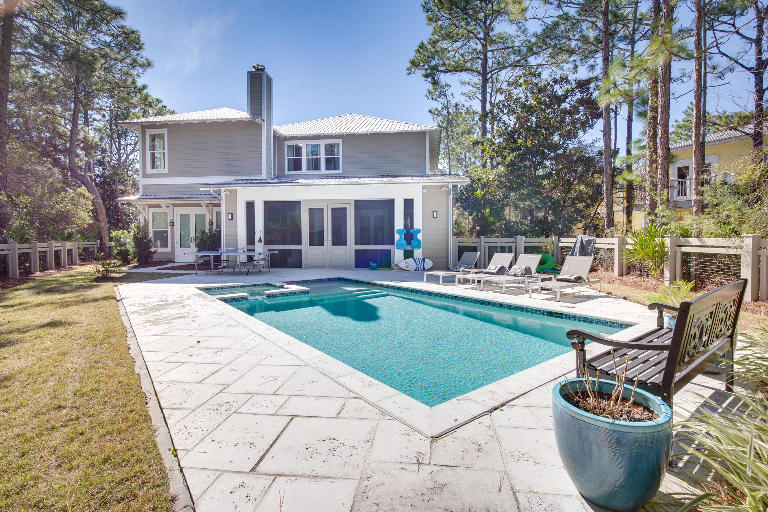 This spectacular custom home was built by Samuel Taylor Homes and is the builders personal home, so no details were left out.  The home has a large living area with open floor plan with the gourmet kitchen opening up to the dining and living area.  Off of the main living area is a large screened in porch with with a wood burning fireplace, TV and a built in gas grill with sink and beer Tap, making this the ultimate entertaining area.  This porch opens up to an expansive fenced in back yard with large pool and hot tub.The kitchen has Wolf Stove, convection microwave, wine cooler, ice maker and walk in pantry.There are two bedrooms on the first floor  including the master with an expansive closet and beautiful shower and tub wet room.Upstairs you have 3 bdrms and a large bunk area.