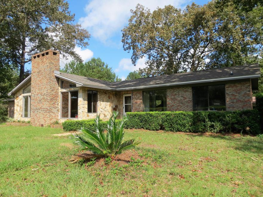 2.5 acres, Paved Road all brick, Big Red Oaks and a fireplace! This beautiful home has 2.5 acres, three bedrooms two baths and an open floor plan! The new roof, new A/C is in place! The large windows let lots of sunlight in and you can see the beautiful yard! There is an attached garage, a detached 18x20 carport and a barn out back! Plenty of room for the boat, four-wheeler or the wood working shop! Newly renovated and ready to be HOME! The location is just north of Crestview and Just south of Laurel Hill!