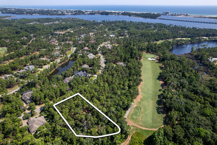 Nestled within the secure, gated community of Wild Heron, you'll discover this magnificent 1.14-acre wooded lot. It's a truly exceptional find, adjacent to the 12th tee of the renowned Shark's Tooth Golf Course, meticulously designed by Greg Norman and consistently recognized as one of Florida's top 5 golfing destinations. You have the flexibility to acquire this property on its own or explore the option of purchasing both lot 1613 and 1615, granting you the freedom to craft one or two homes - the potential is boundless! Without the constraints of a mandatory build-out timeline, these homesites cater to a wide range of preferences. Whether you're in search of a second home, a primary residence, or you're a builder looking to diversify your portfolio, these opportunities are versatile. Wild Heron, an exquisite neighborhood, upholds rental restrictions and graces the picturesque shores of Lake Powell, Florida's largest coastal dune lake. Here, you'll find a lifestyle of luxury, enriched by some of the most opulent amenities along the Emerald Coast.